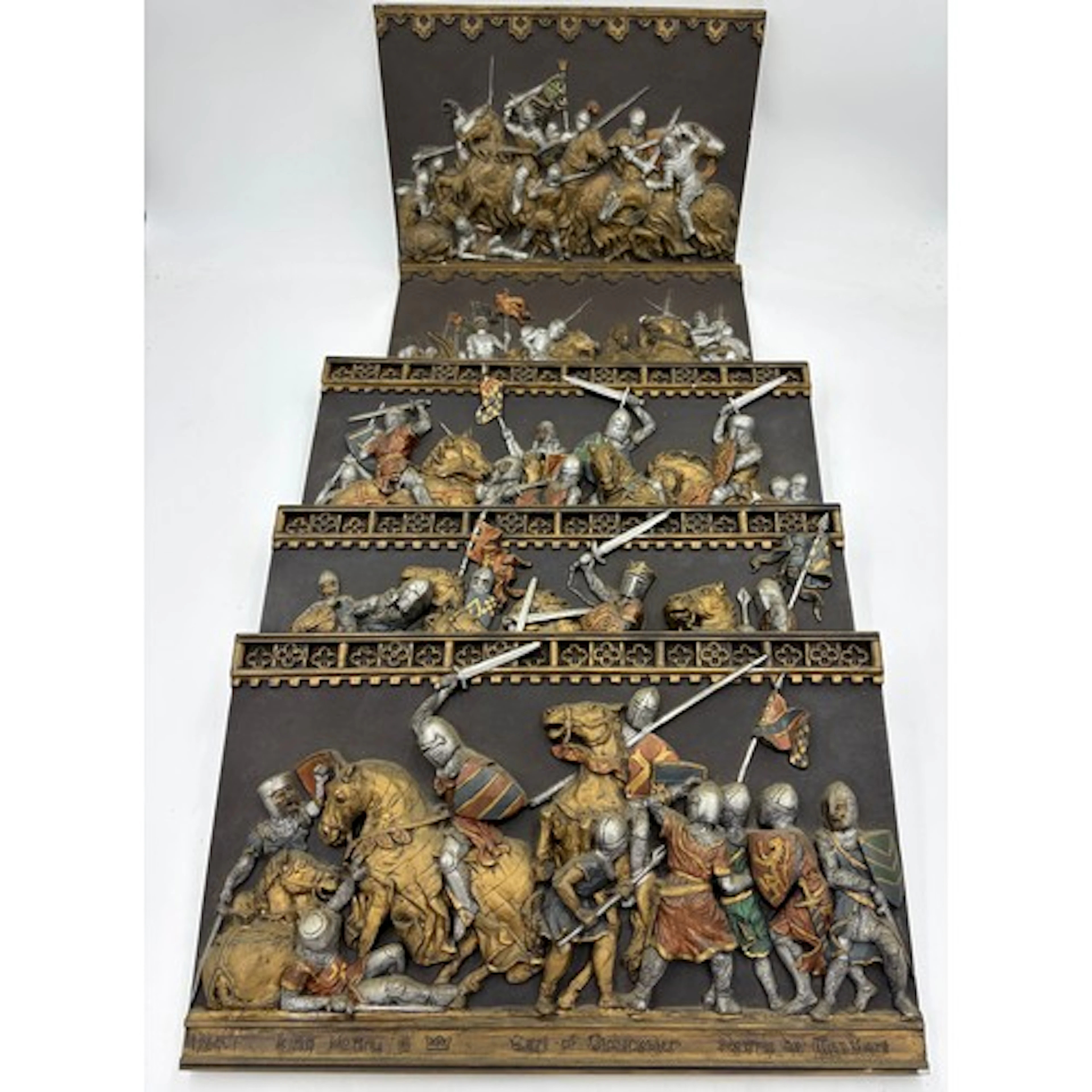 Five Marcus Designs ceramic wall plaques depicting 'Battle o...