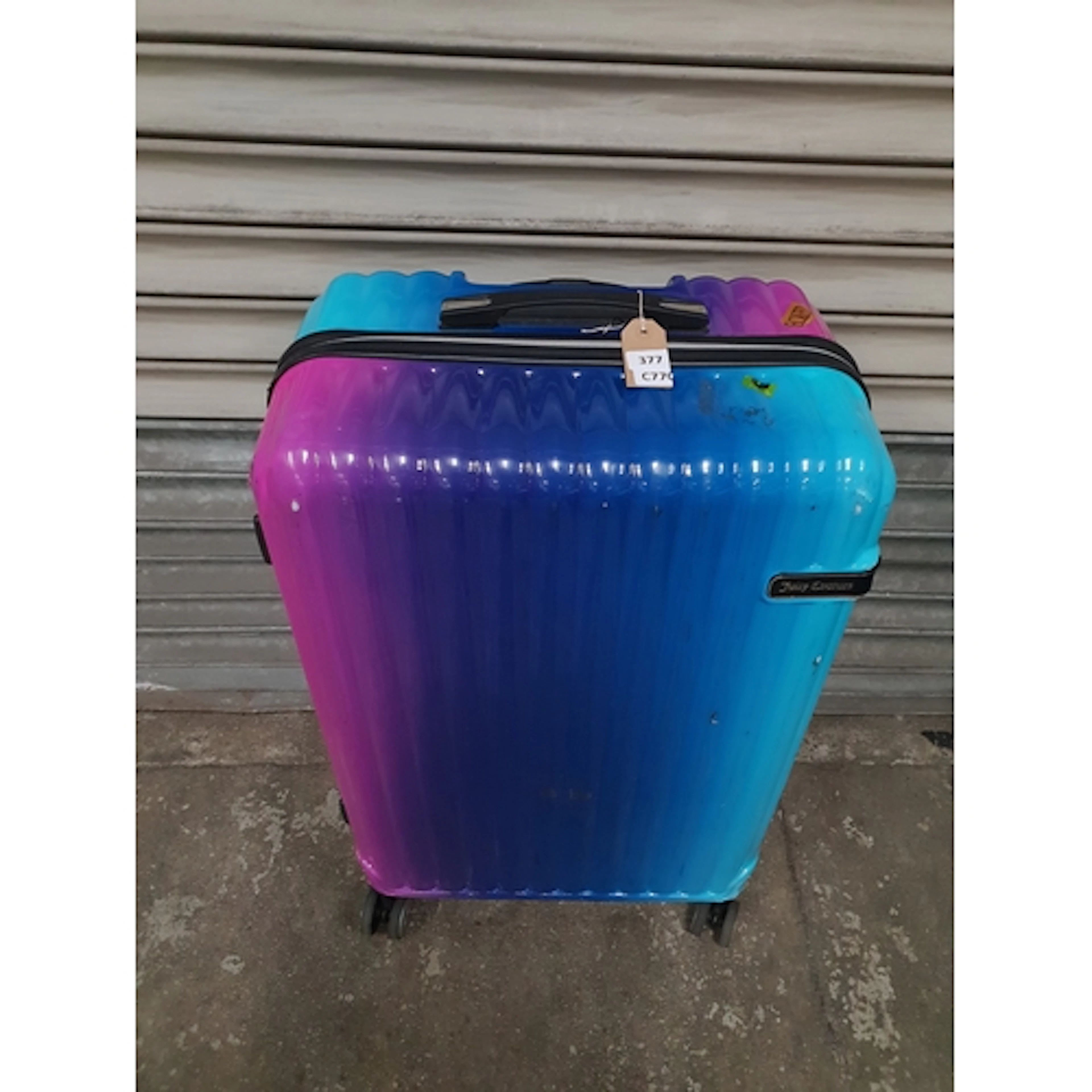 ONE JUICY COUTURE SUITCASE Note: Suitcases and bags are empt...
