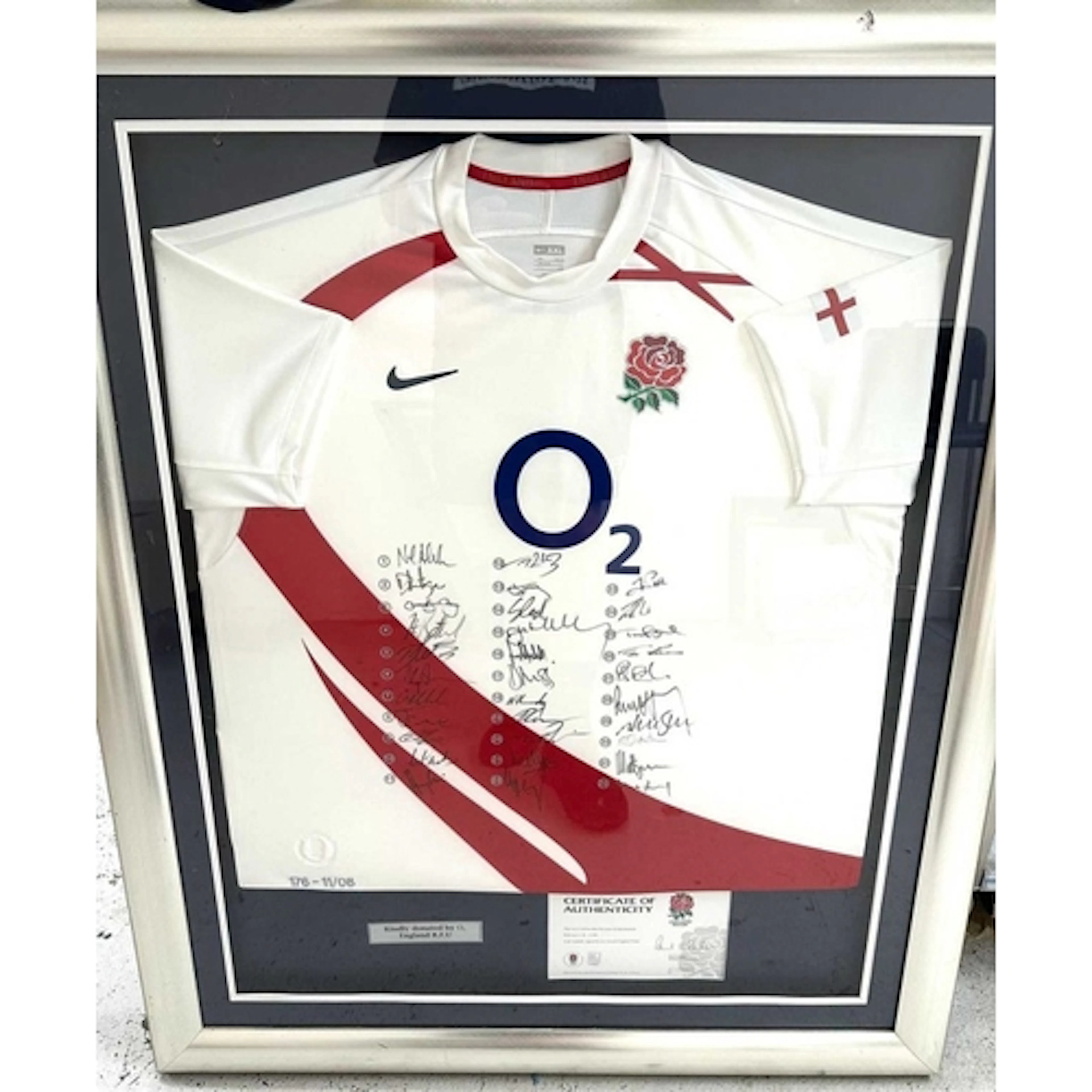 A framed and signed England Rugby jersey with C.O.A and a lo...