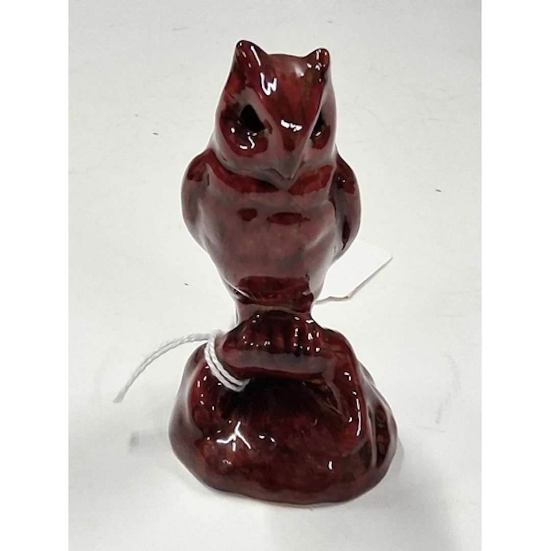 A BERNARD MOORE FLAMBE FIGURE OF AN OWL, perched on a root, ...