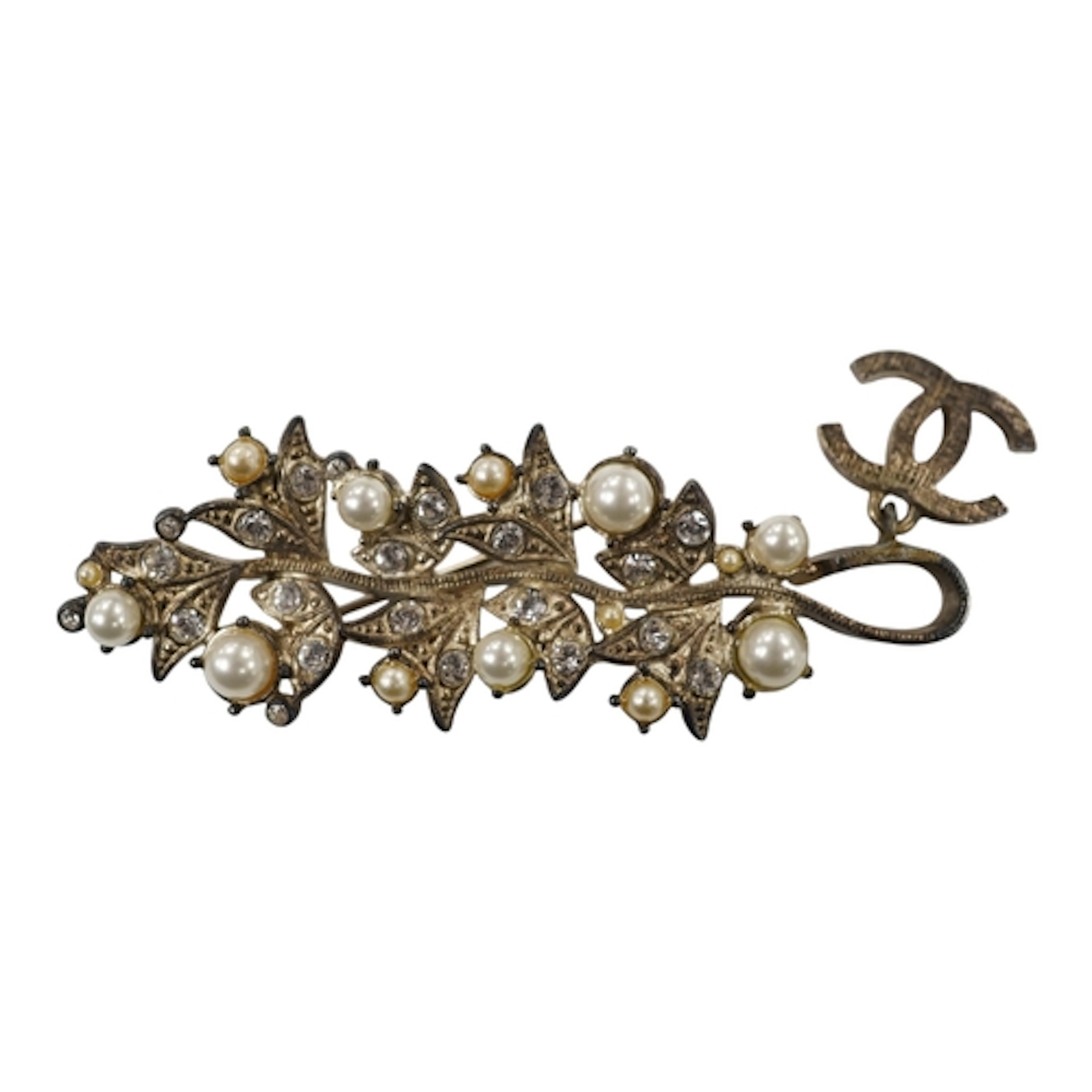 A Chanel costume brooch, set with simulated pearls and simul...