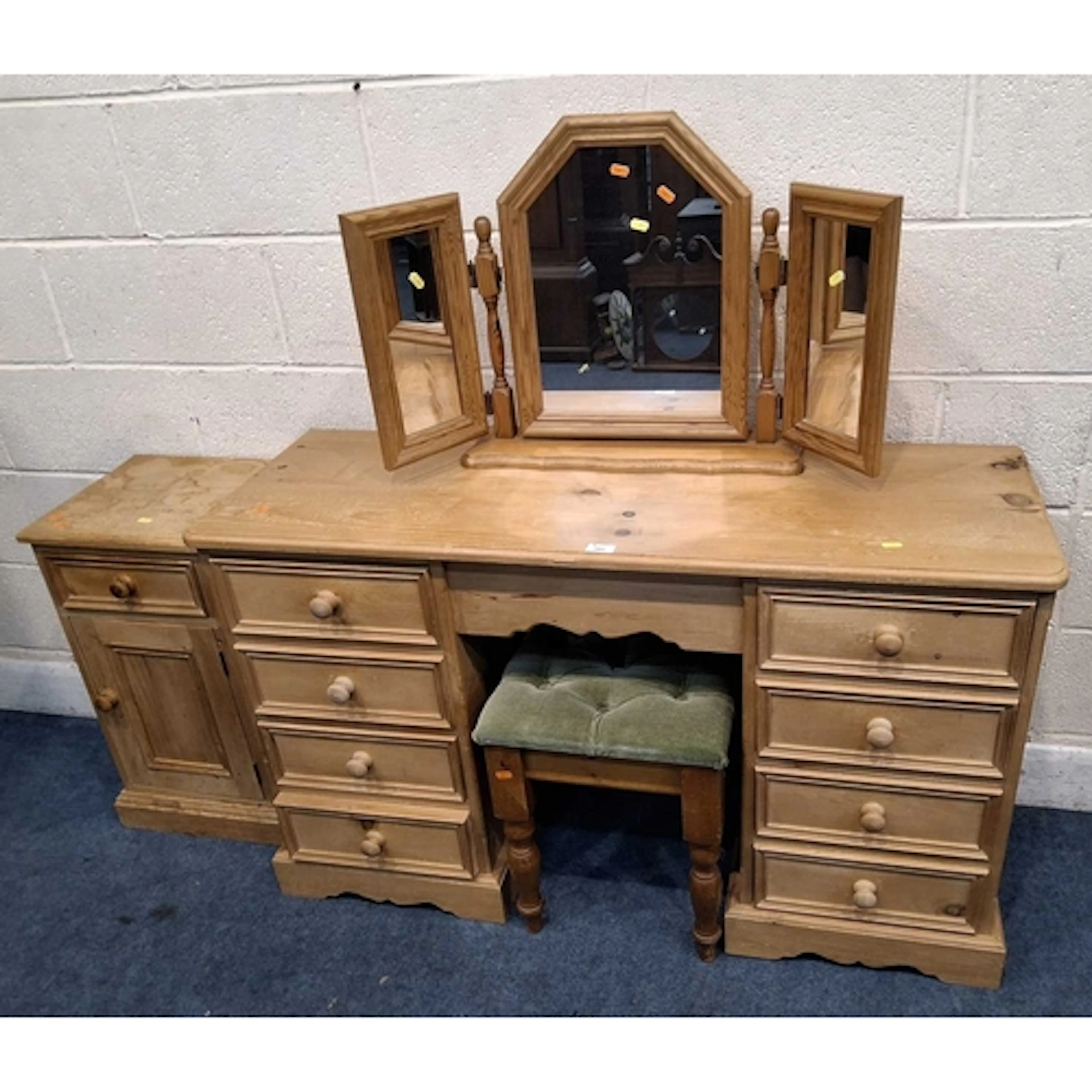 A MODERN PINE DRESSING TABLE, fitted with eight drawers, alo...