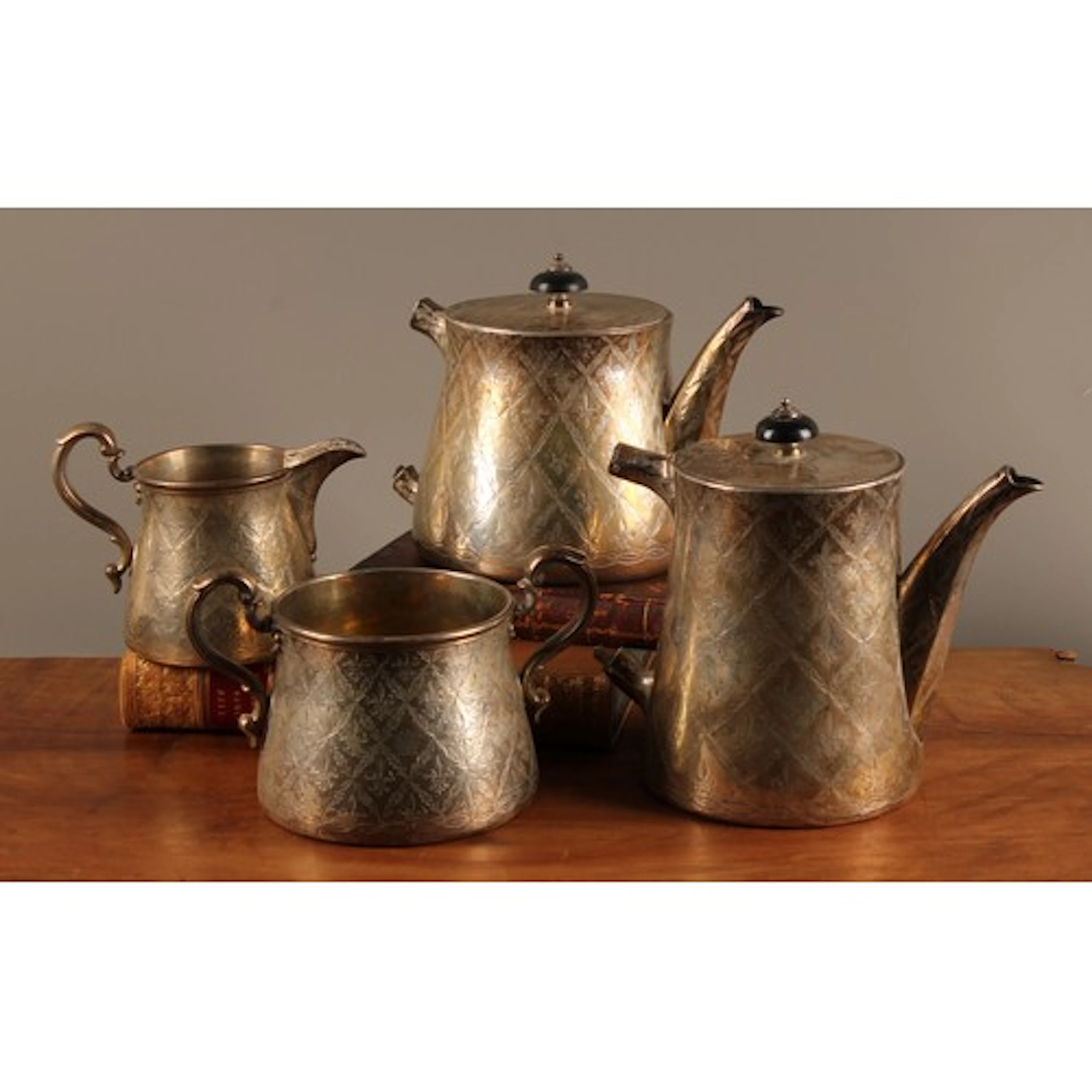 A Victorian silver four piece tea and coffee service, chased...