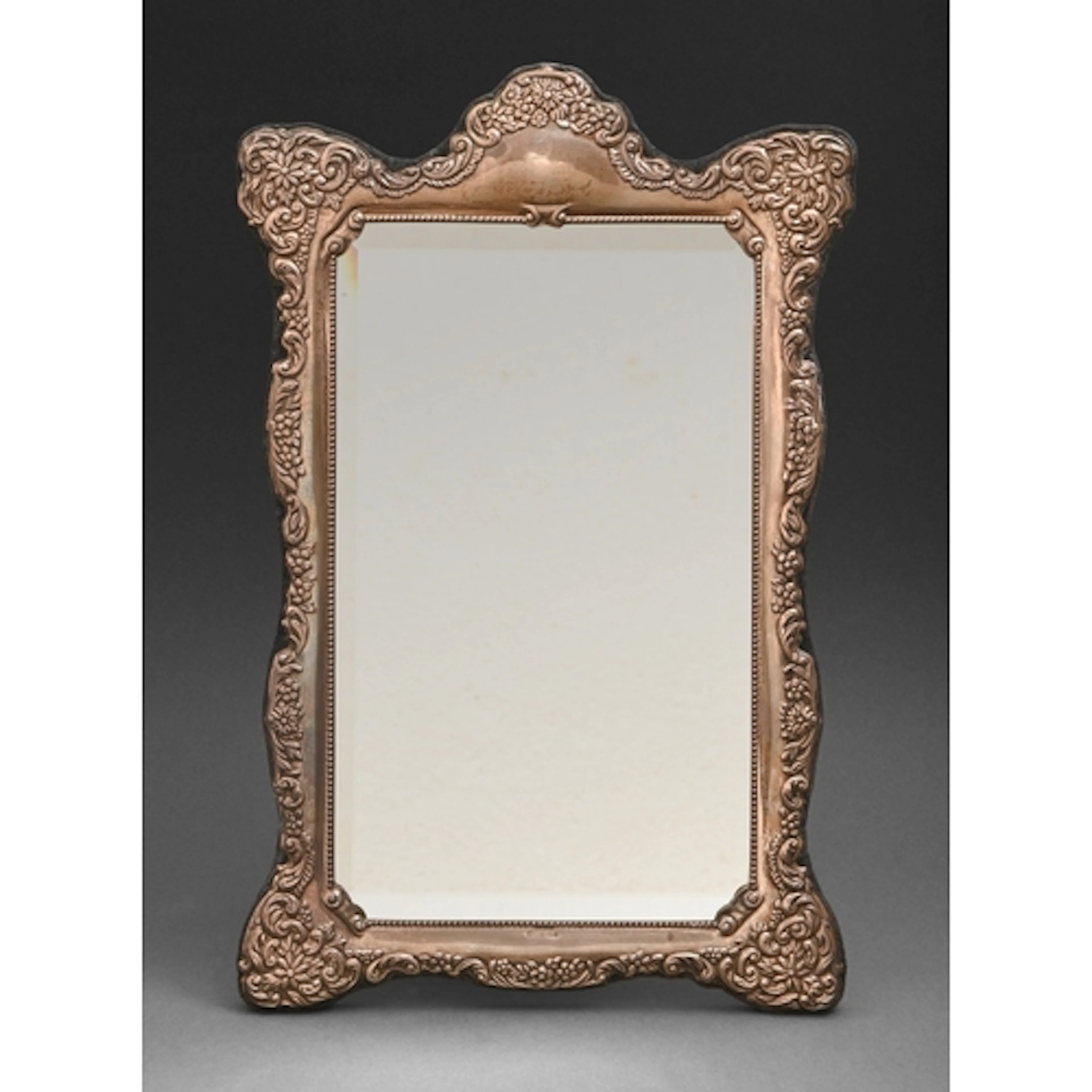 An Elizabeth II silver mirror, in Victorian style, 37cm h, b...