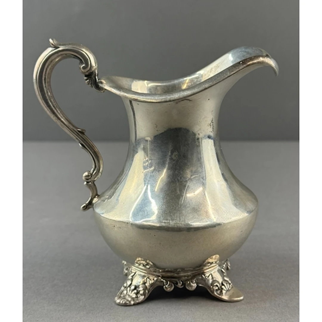 Silver: a cream jug by William Smily, London 1842, a flared ...