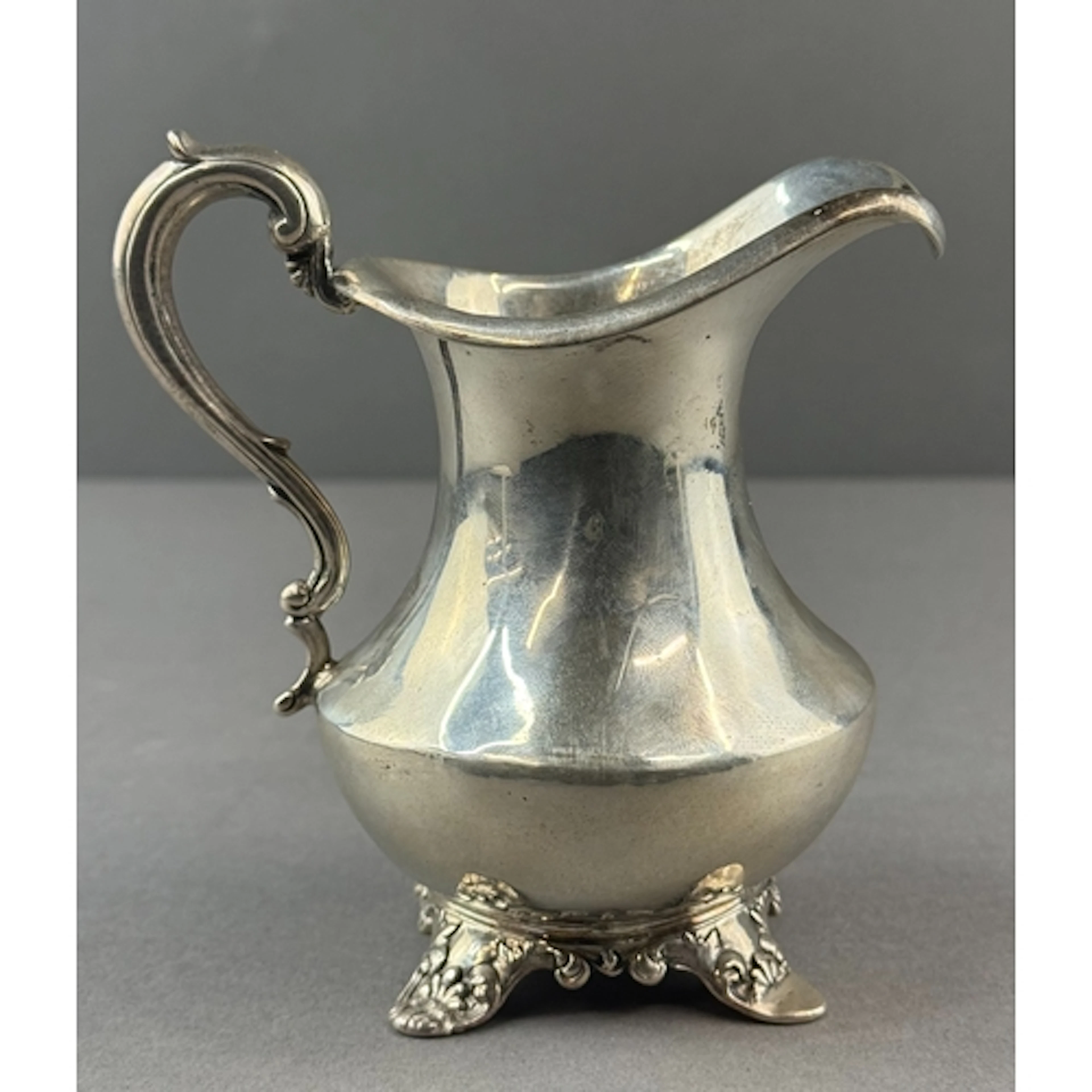Silver: a cream jug by William Smily, London 1842, a flared ...