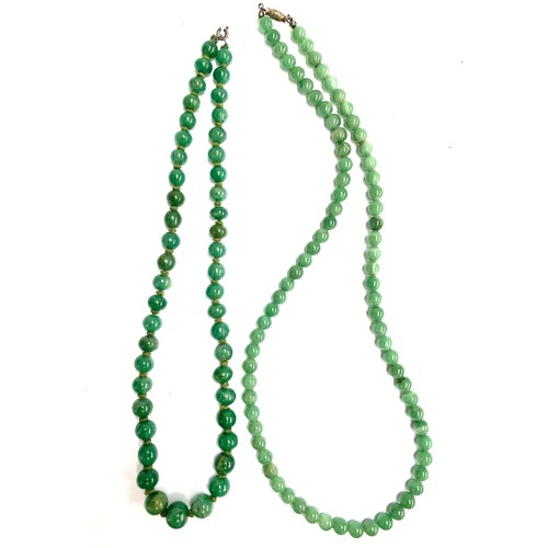 A vintage jade type bead necklace, the beads 7mmD, 61cmL. 53...