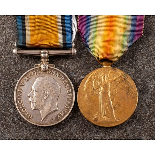 A WWI pair to '243903 Gnr E Edwards RA' War Medal and Victor...