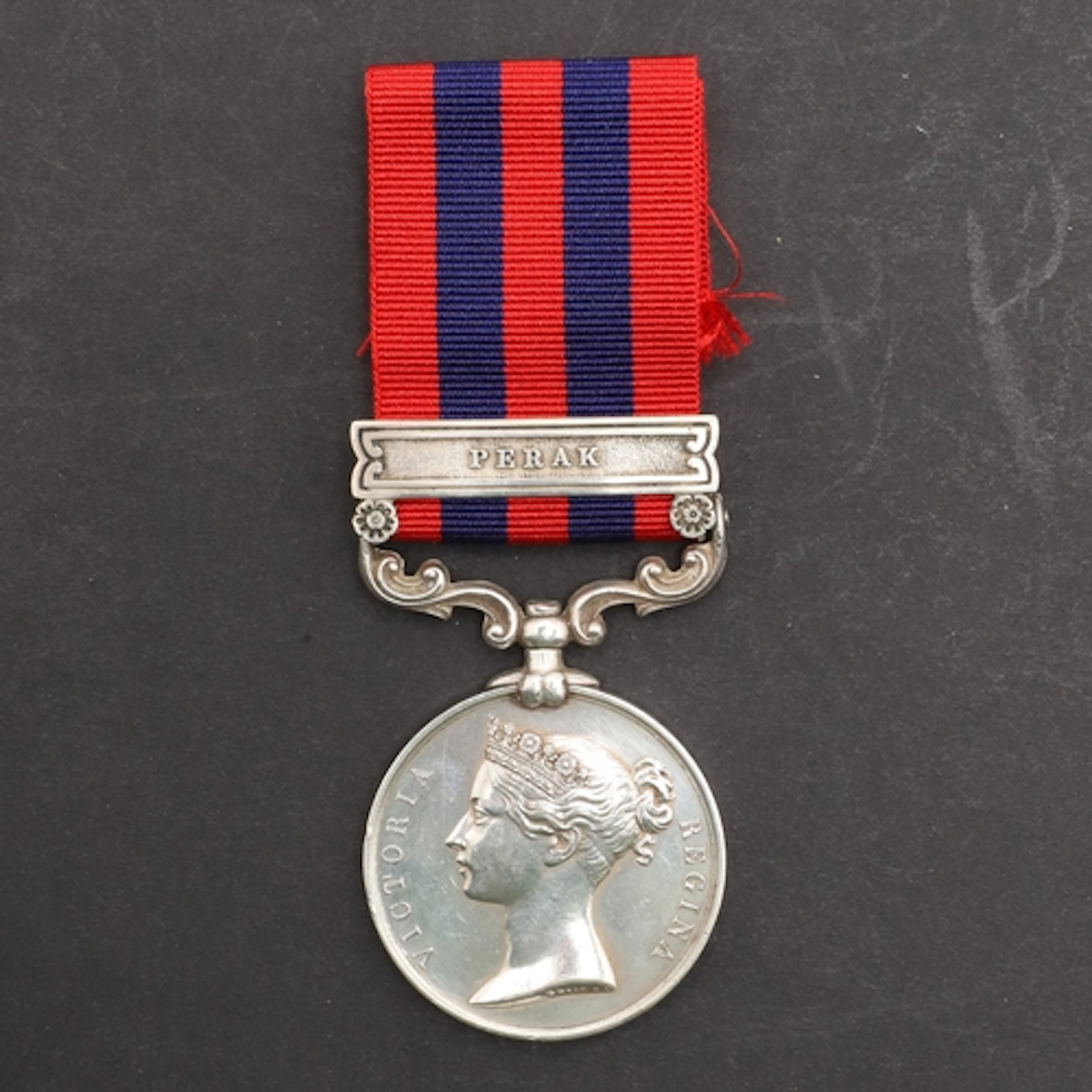 AN INDIAN GENERAL SERVICE MEDAL WITH PERAK CLASP TO H.M.S. C...
