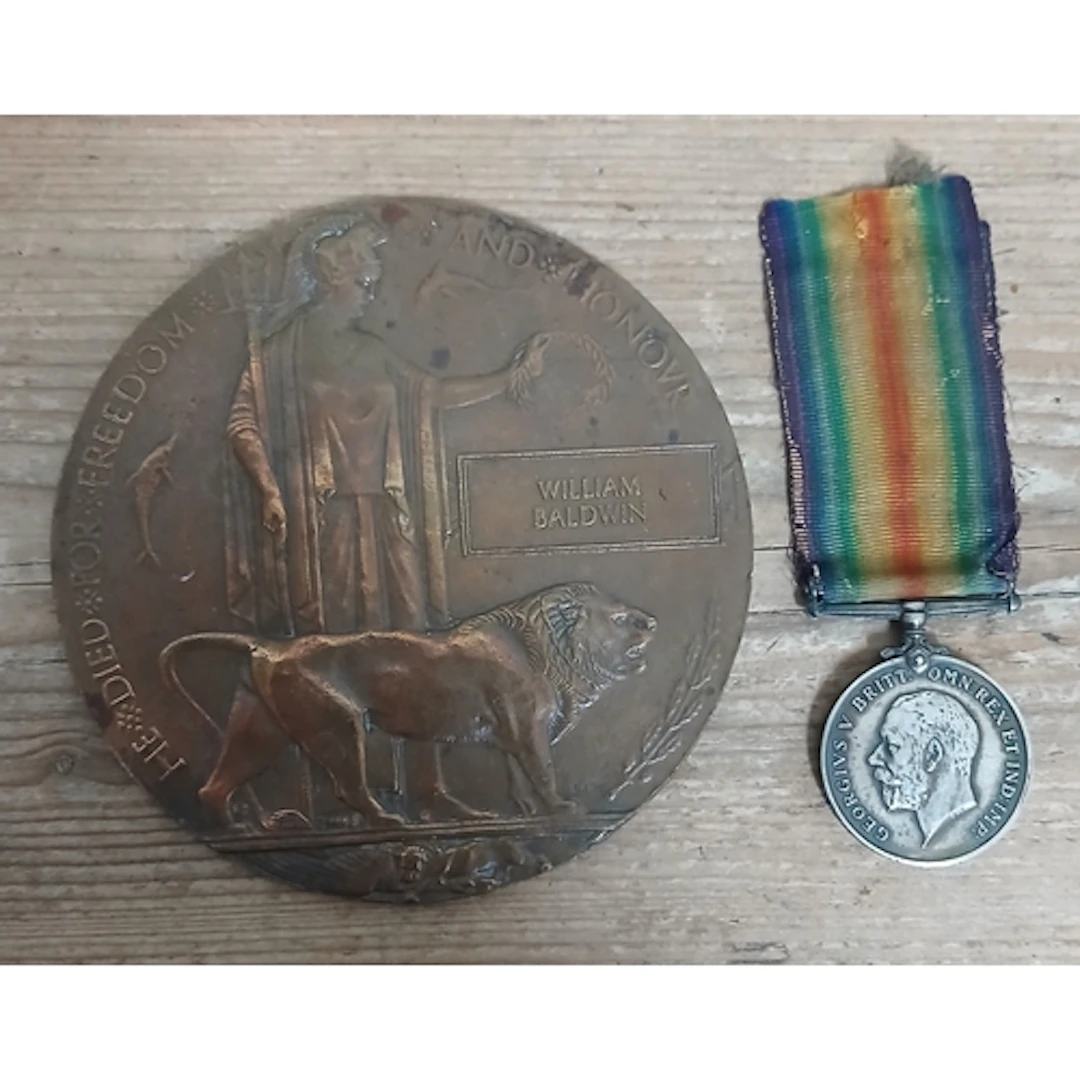 A WWI bronze death plaque and 1914-1918 war medal awarded to...