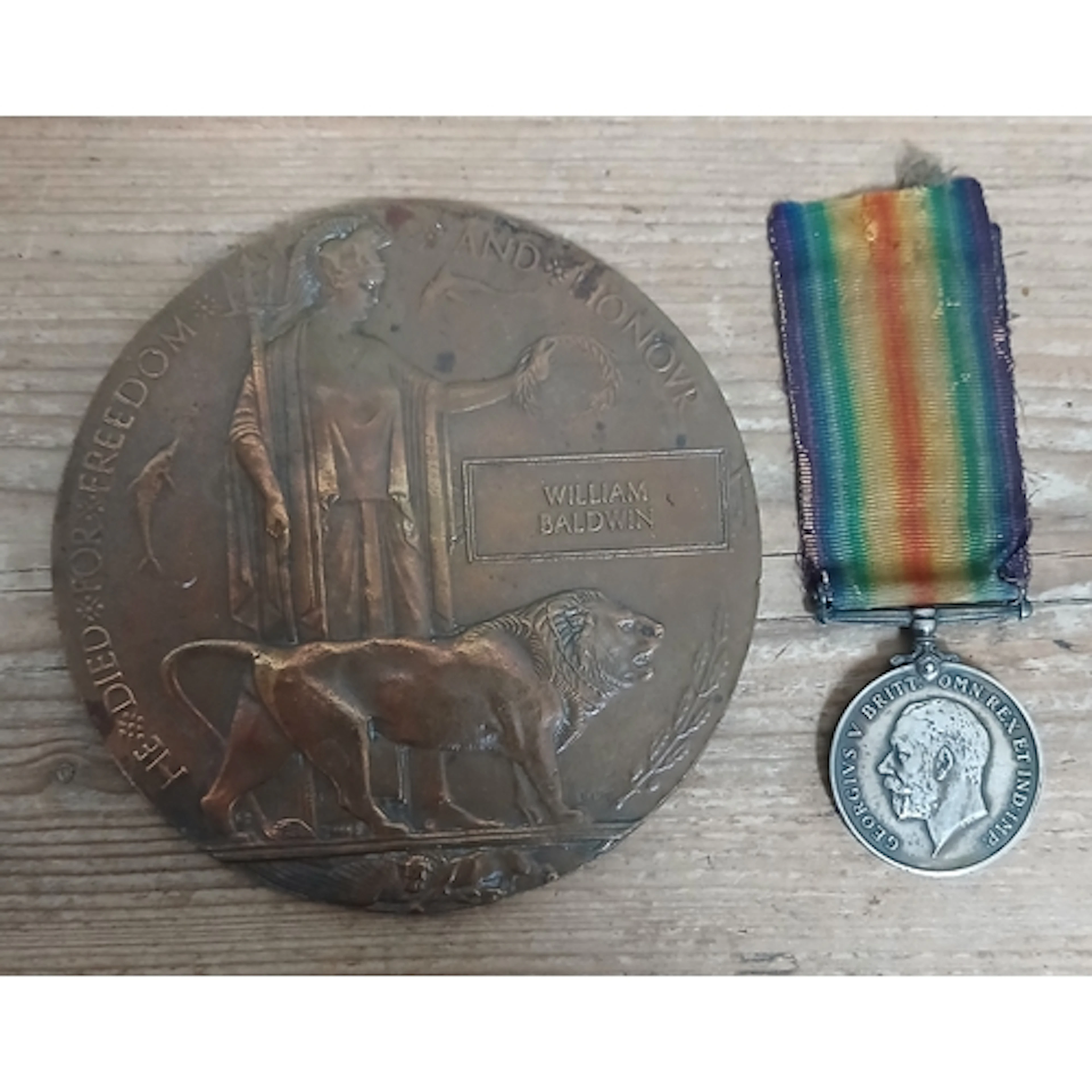 A WWI bronze death plaque and 1914-1918 war medal awarded to...