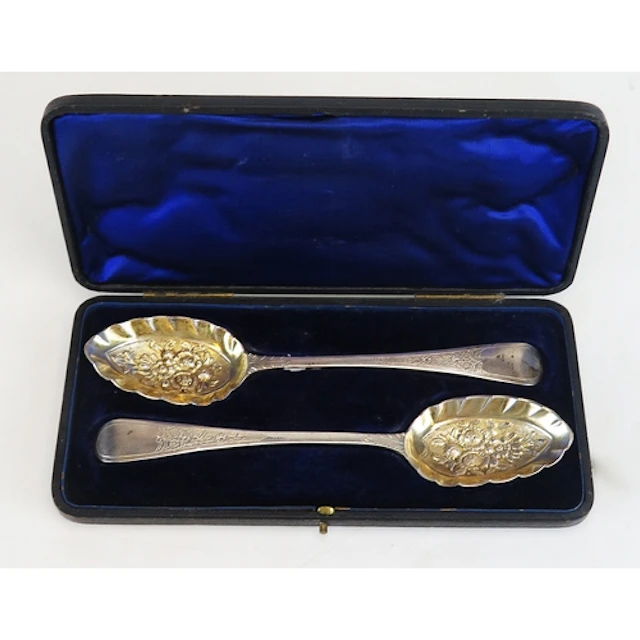 A pair of Edward VII Old English pattern silver berry spoons...