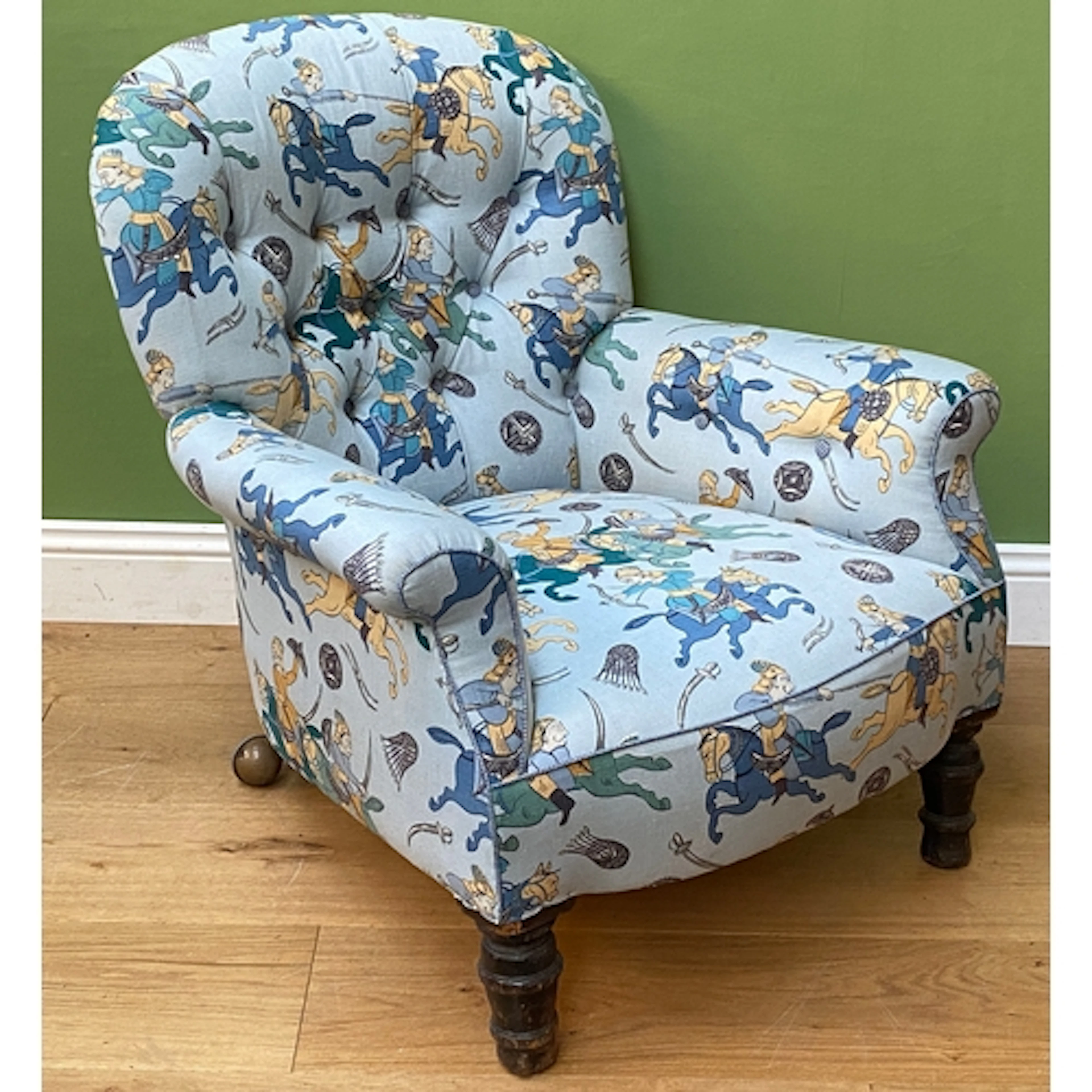 A late Victorian/early 20th century button upholstered armch...