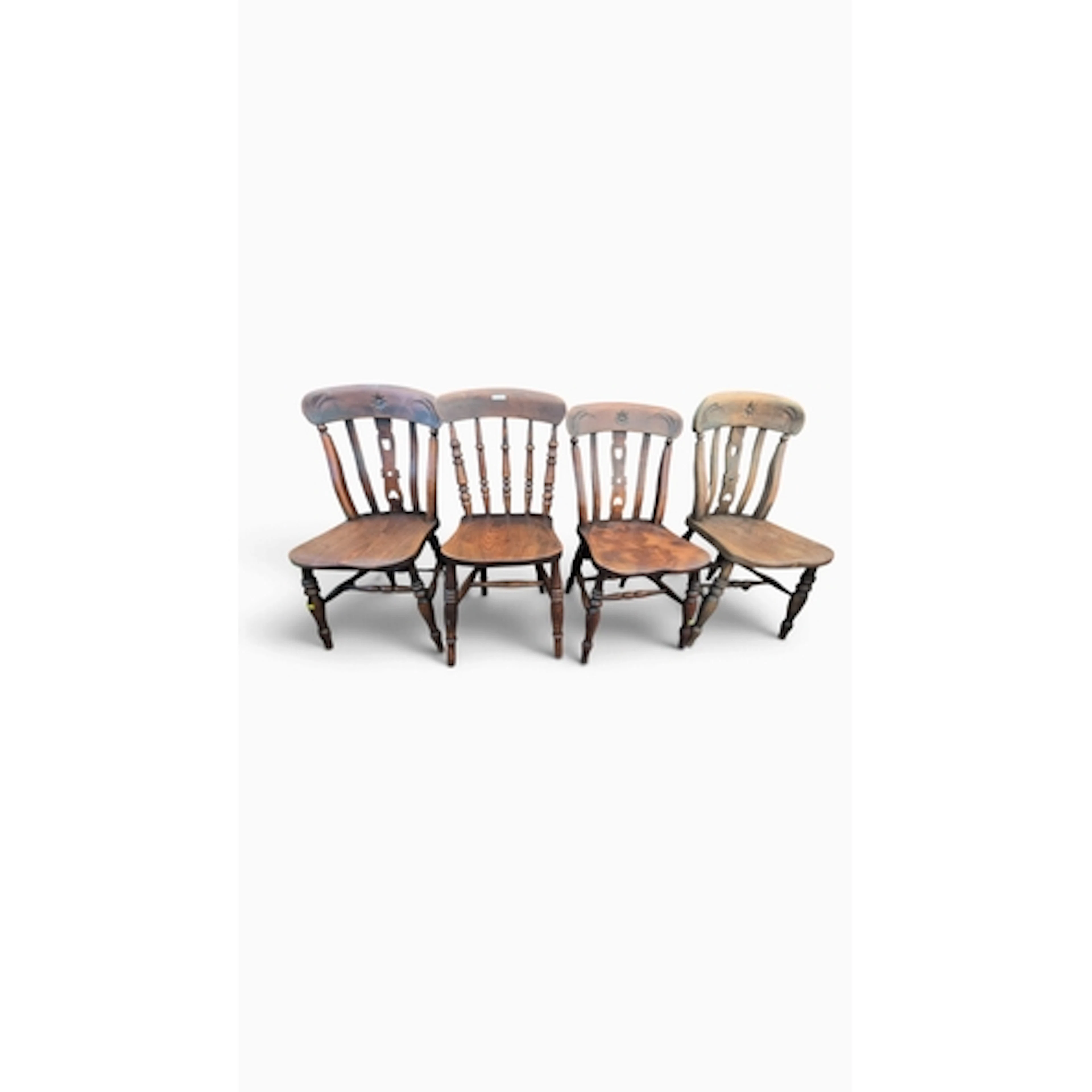 Four elm-seated country dining chairs: three with pierced sp...