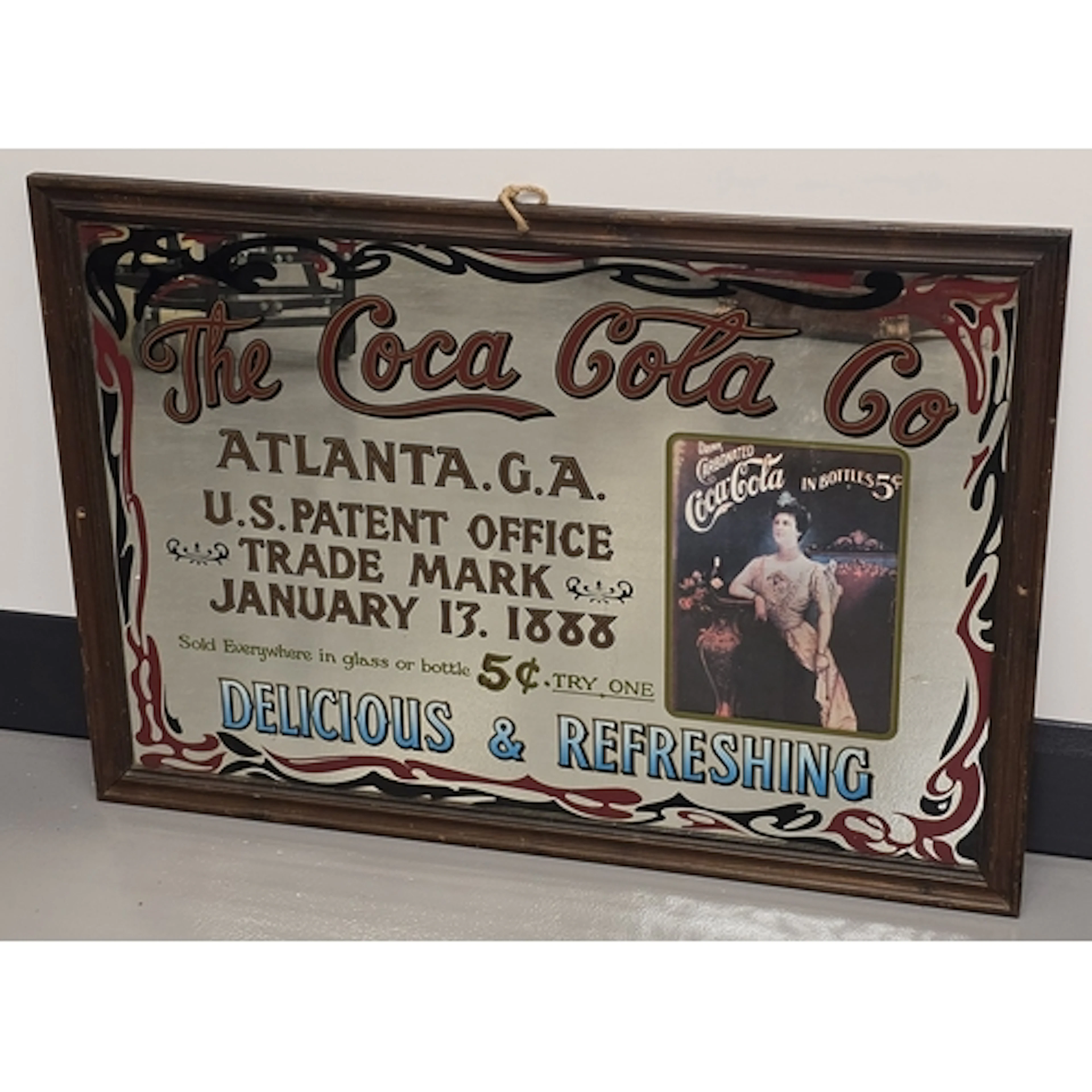 A large vintage Coca Cola transfer printed advertising mirro...