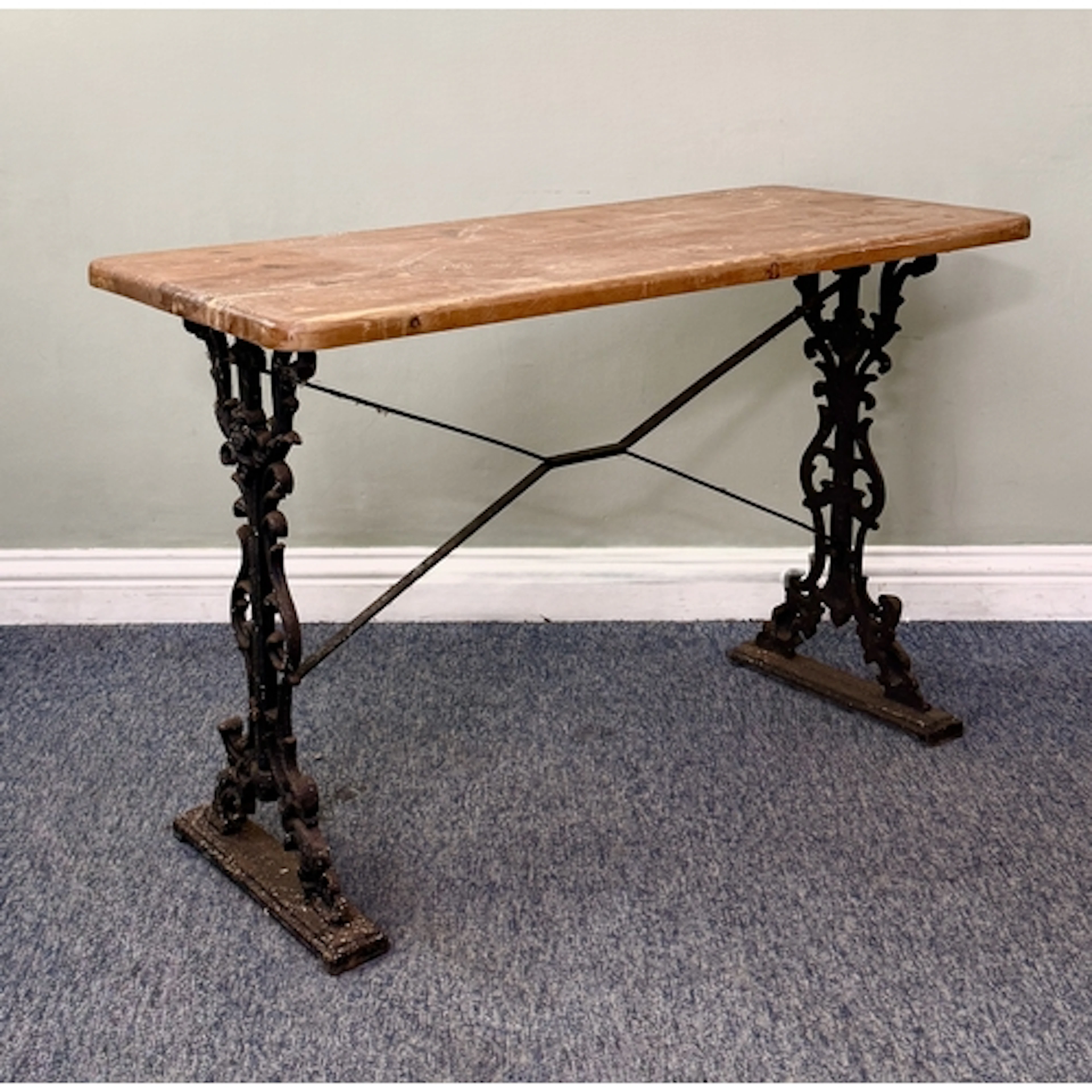 A pine and cast iron pub-style table - the rectangular pine ...