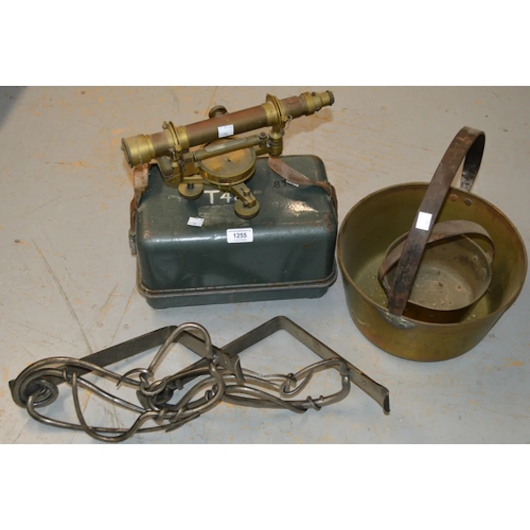 Brass surveyors level, together with a T. 48 level in origin...