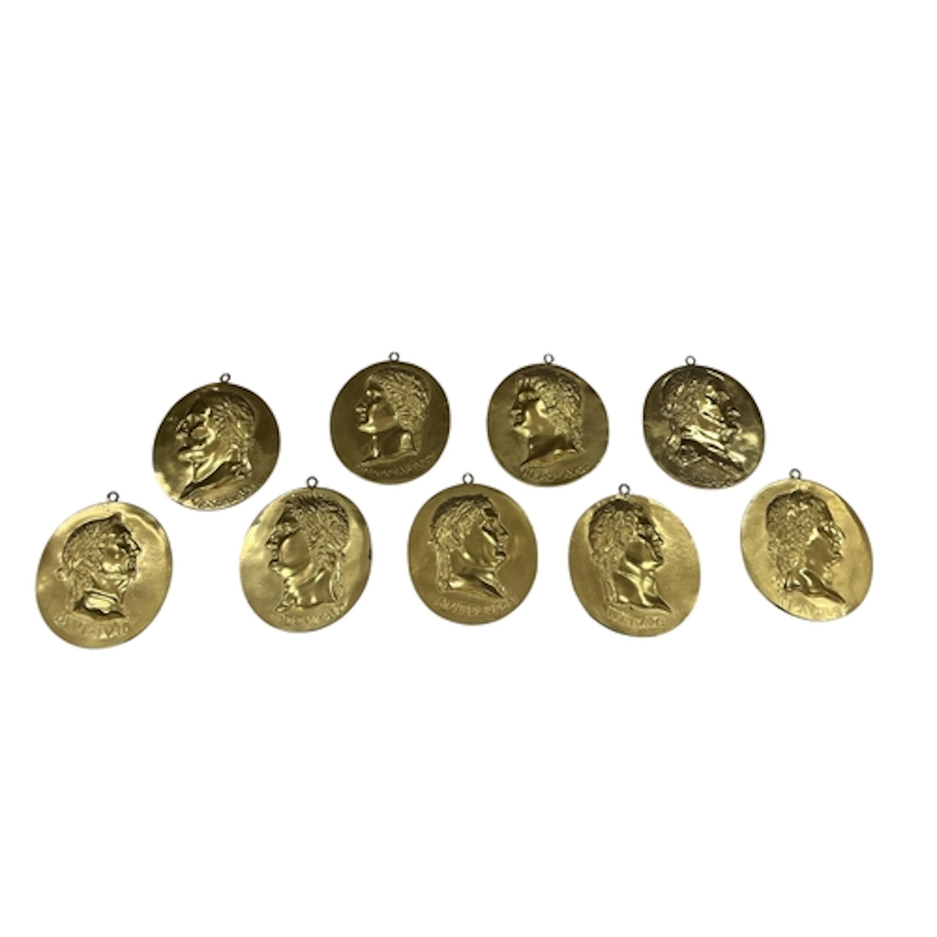 Nine cast brass oval wall plaques depicting busts of Roman e...