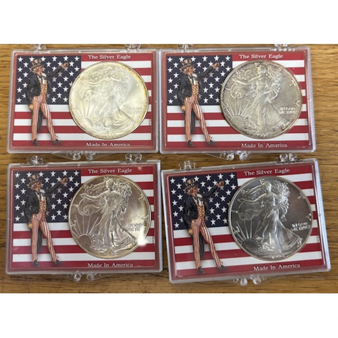 USA. Range of Walking Liberty dollars in red case, generally...