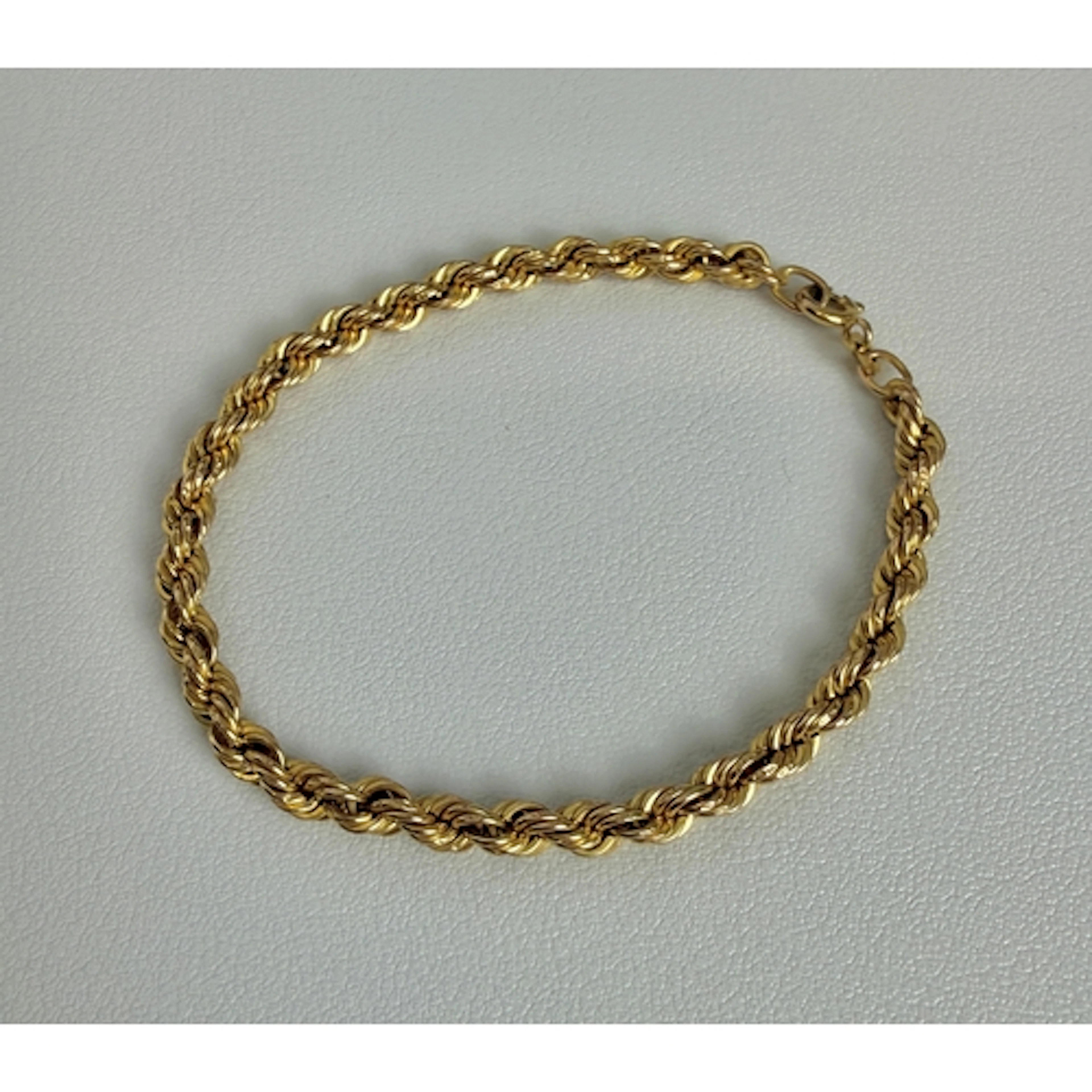 An Italian 9ct yellow gold rope link bracelet - stamped '9K'...