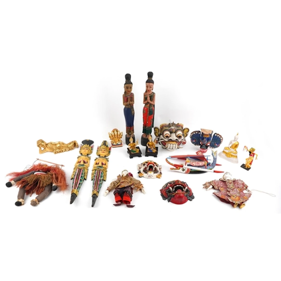 Large collection of Middle Eastern carved wood wall masks, p...
