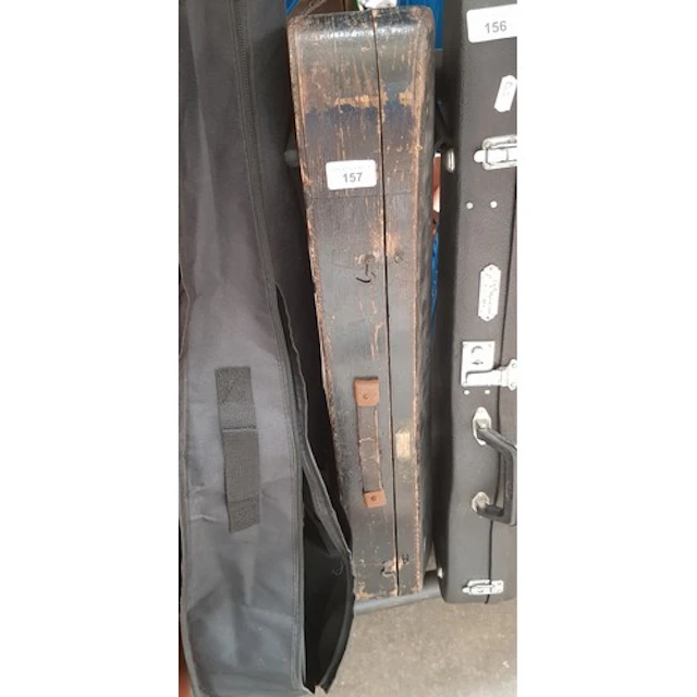 An antique violin with wooden case.