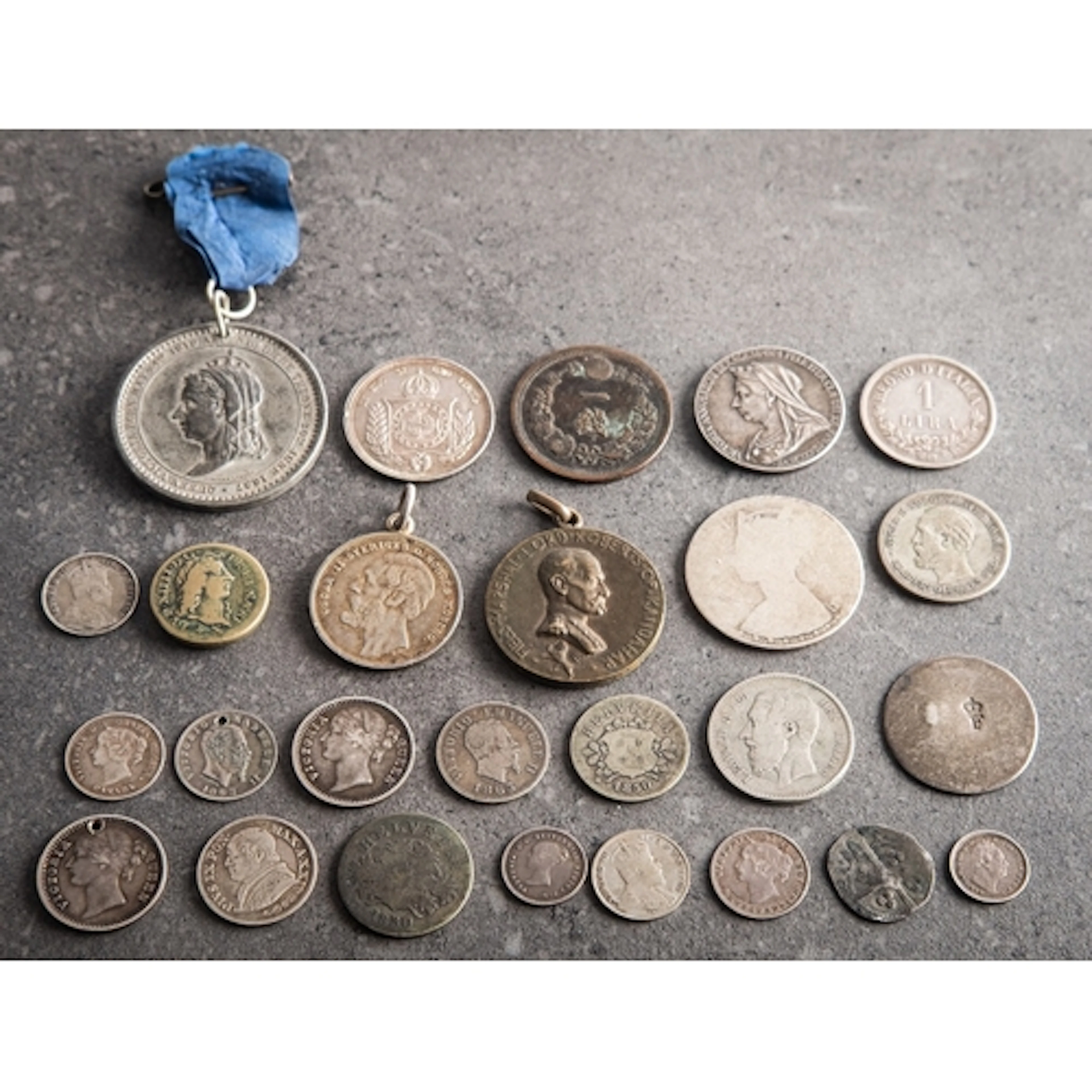 A mixed group of foreign coins. Including an 1881 and 1886 C...