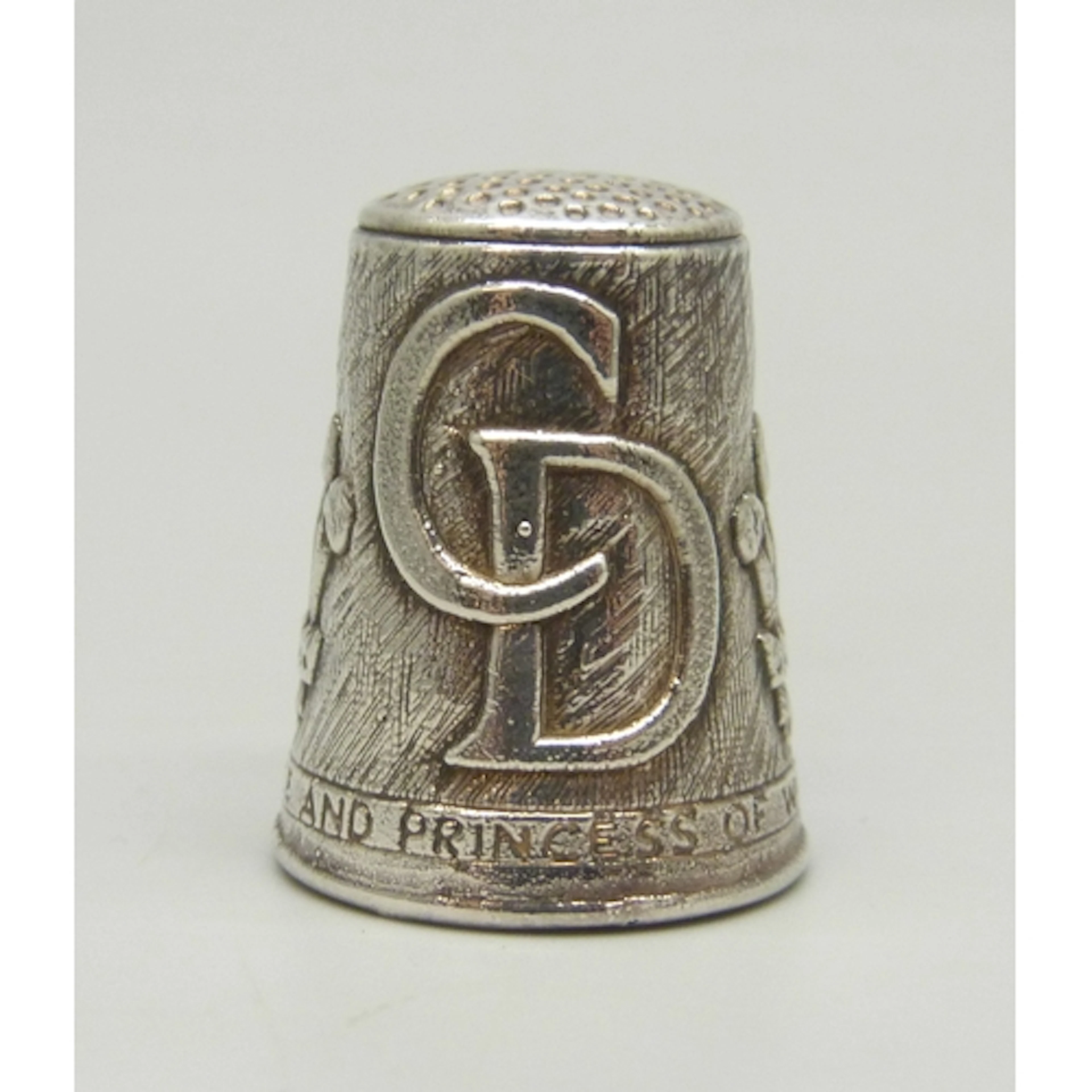 A Prince Charles and Princess Diana commemorative silver thi...