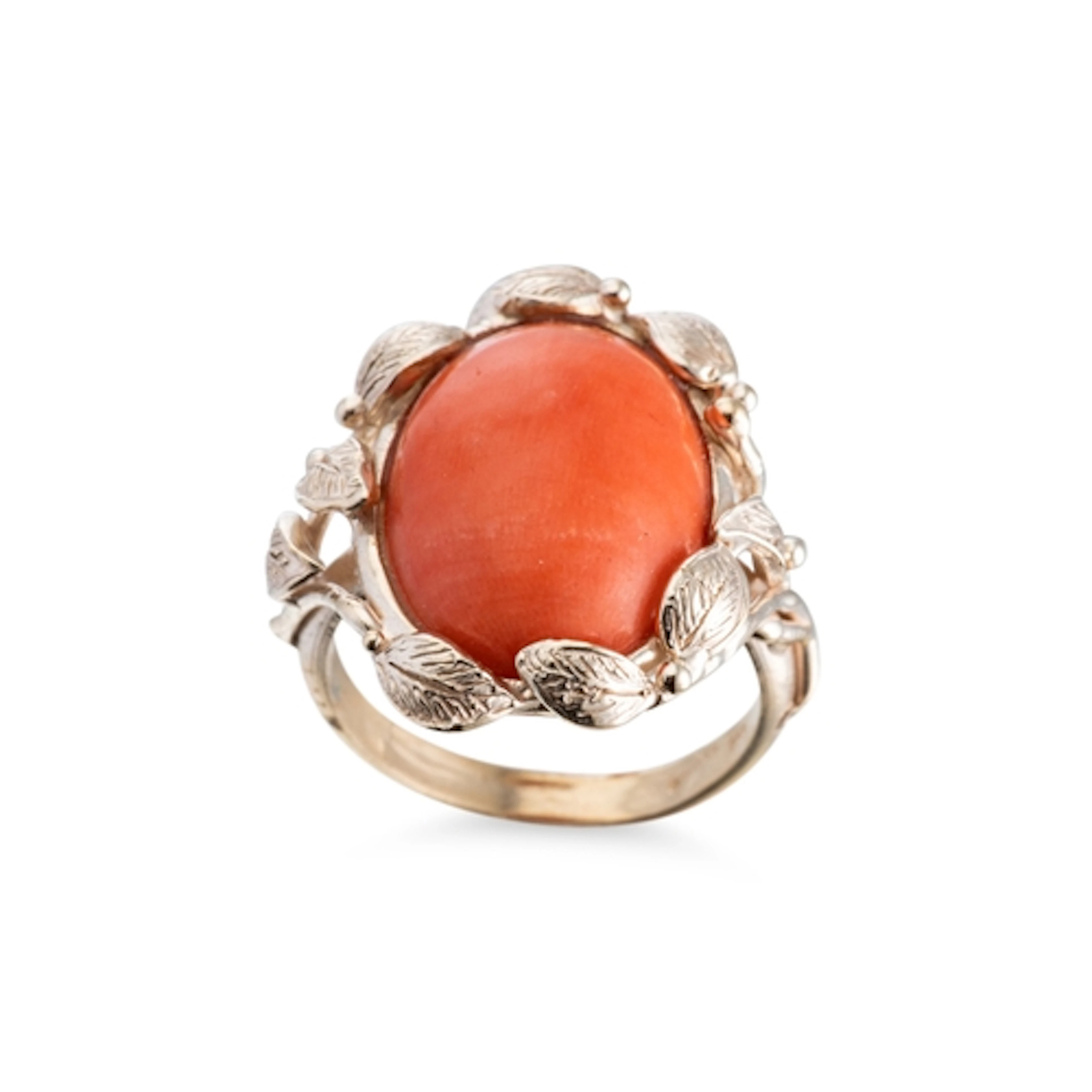 A CORAL SET RING, to naturalistic surround, mounted in 9ct y...