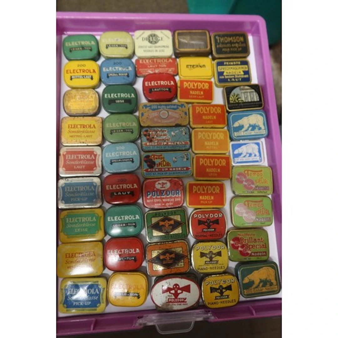 A tray of vintage gramophone needle tins