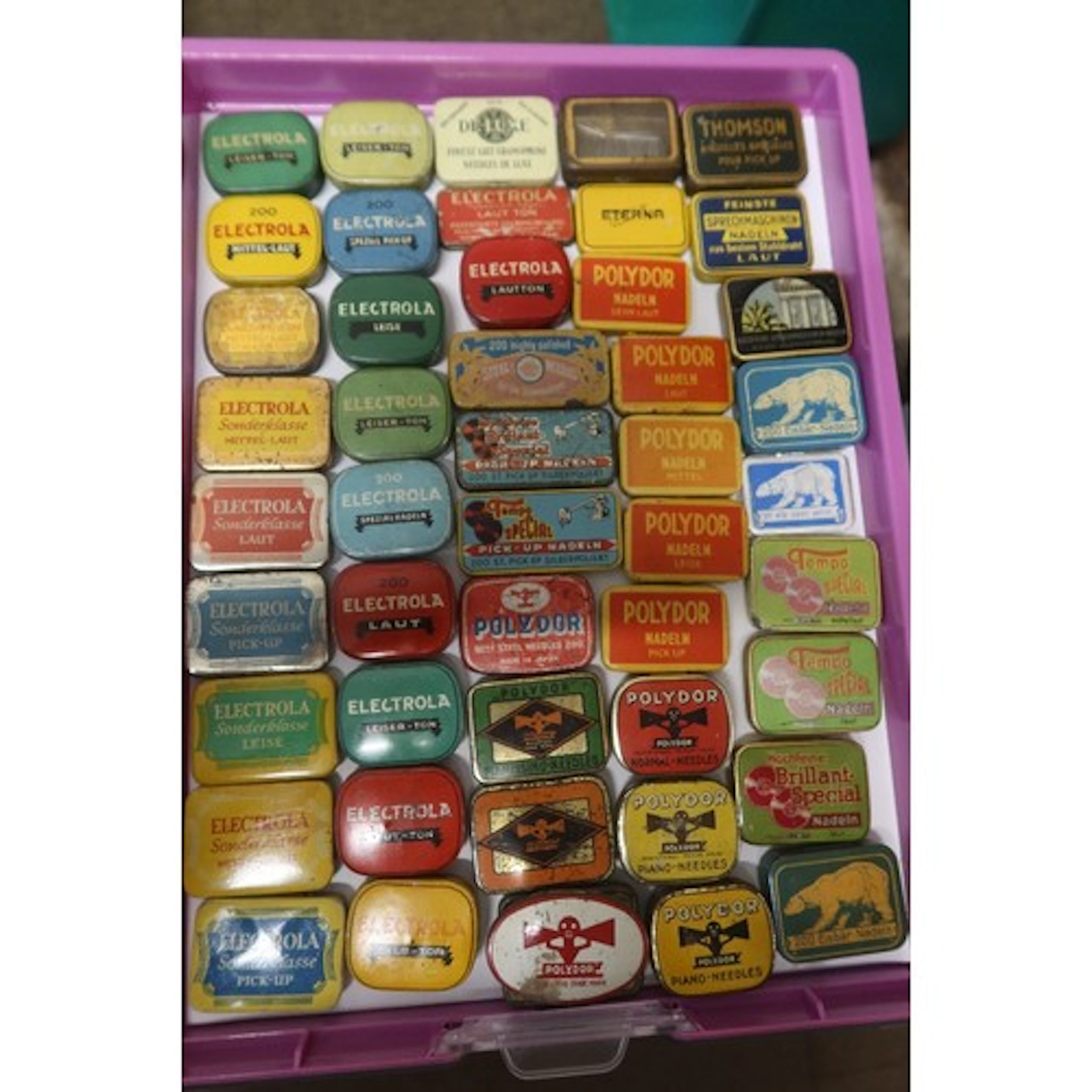A tray of vintage gramophone needle tins