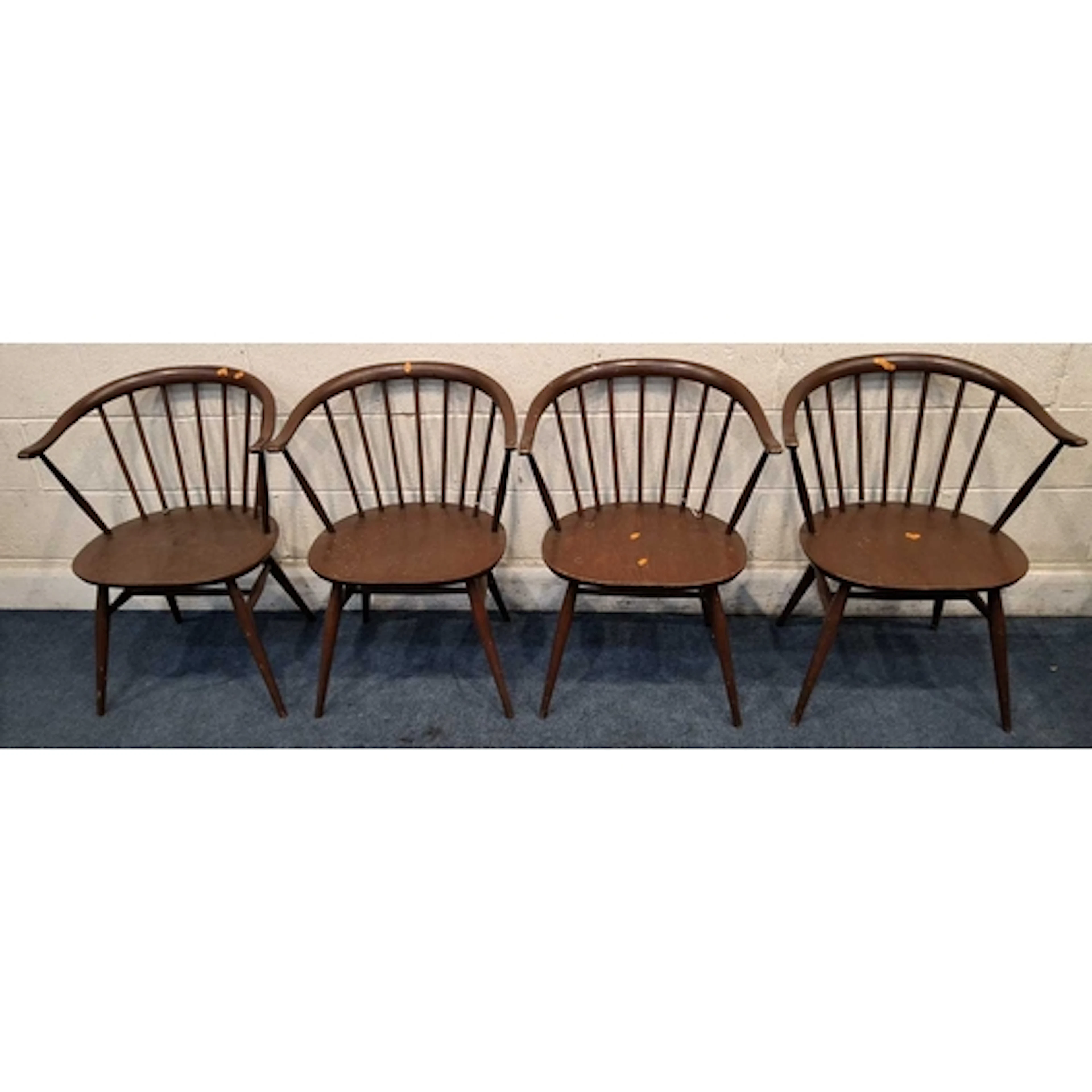 LUCIAN ERCOLANI, A SET OF FOUR ERCOL STAINED ELM AND BEECH A...