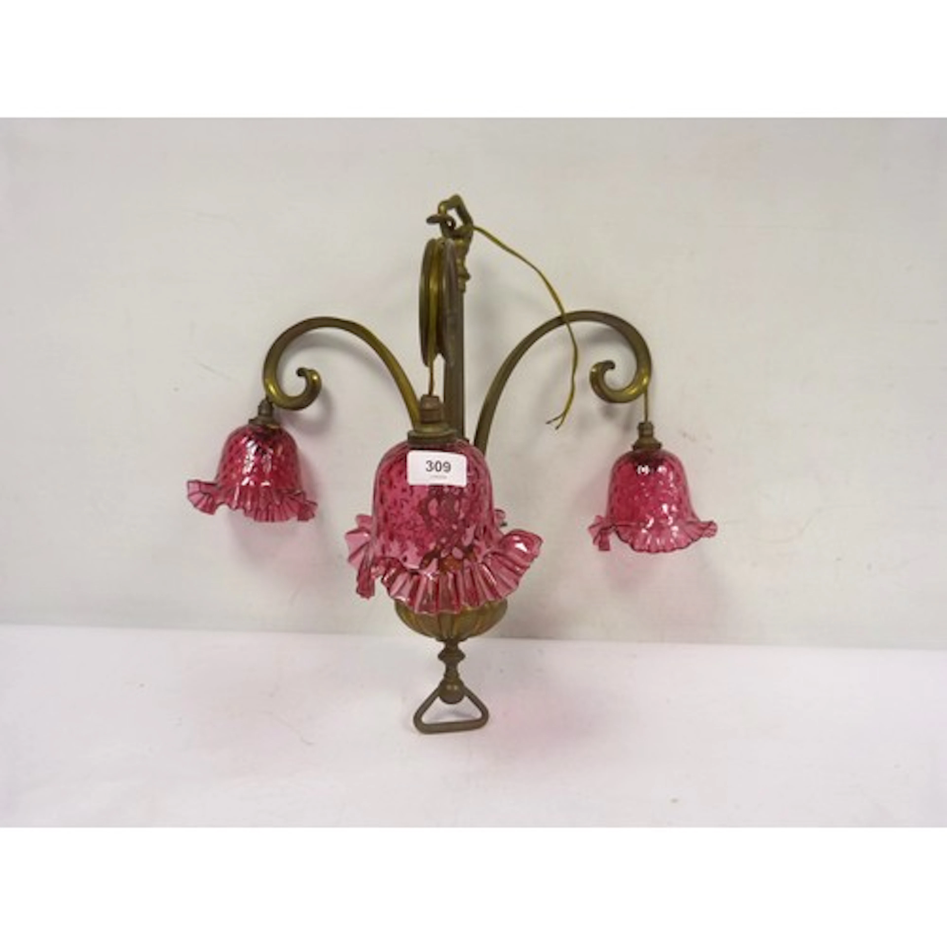 Antique brass three branch ceiling light with cranberry glas...