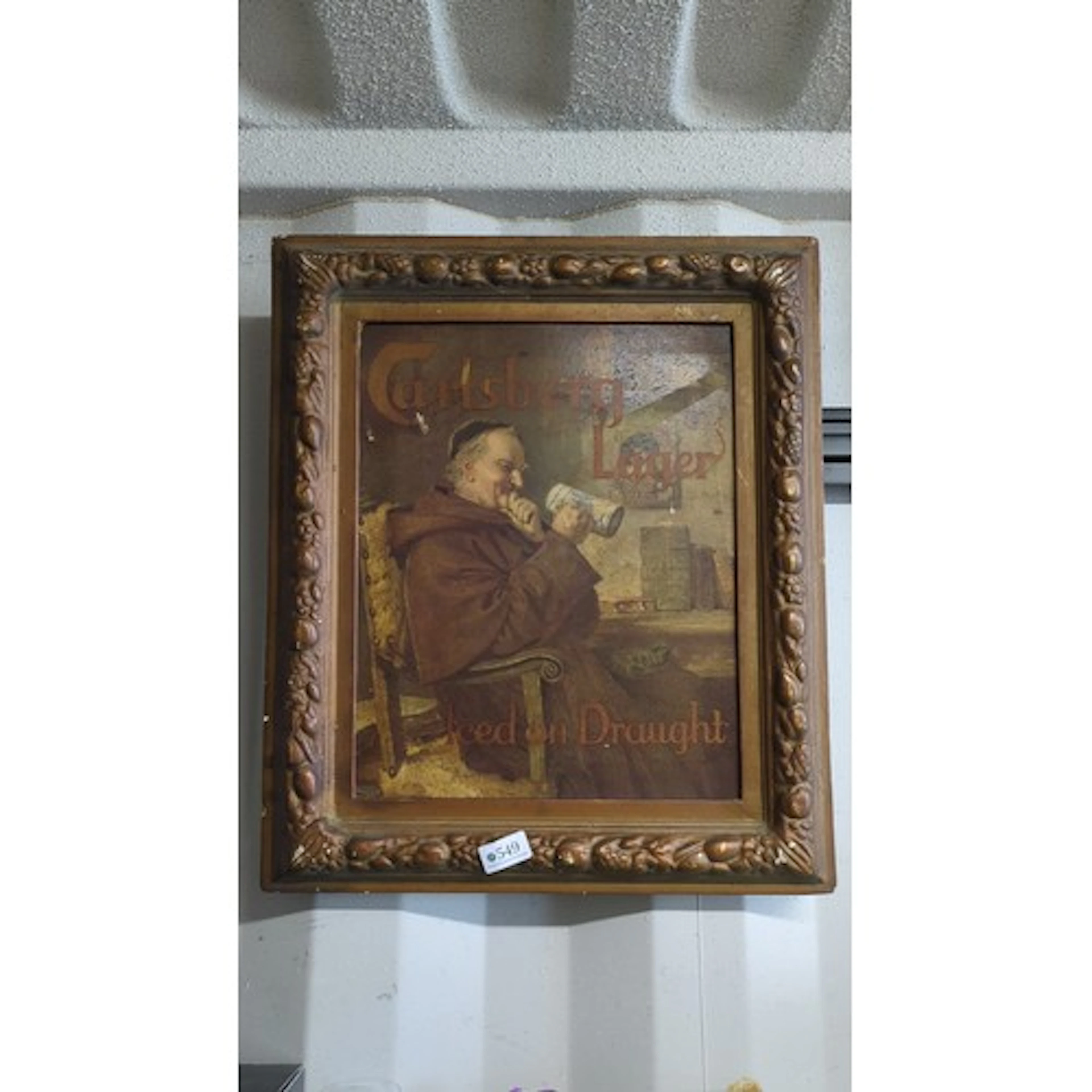 Framed Carlsberg Lager advertising print, depicting a seated...