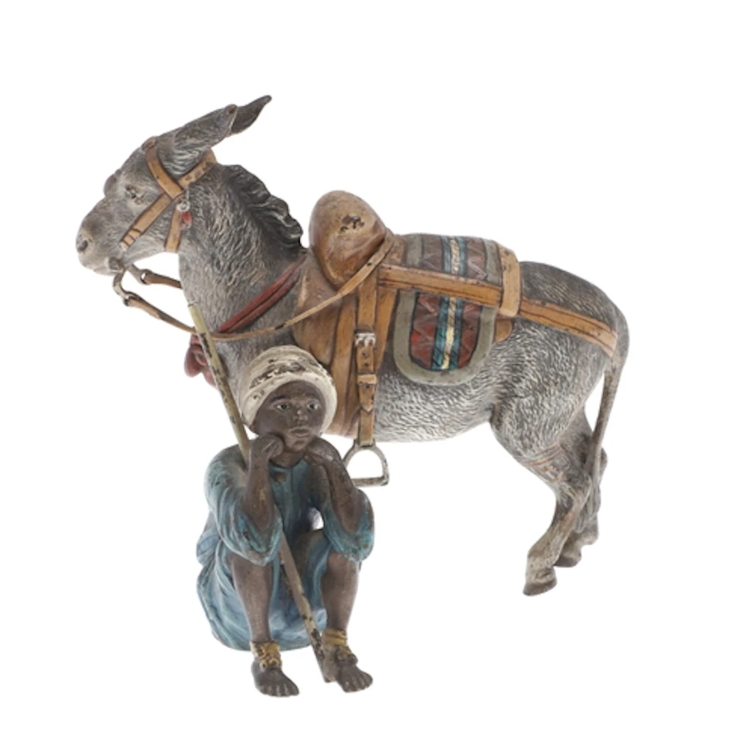 AUSTRIAN COLD PAINTED BRONZE - ARAB BOY & DONKEY. A cold pai...