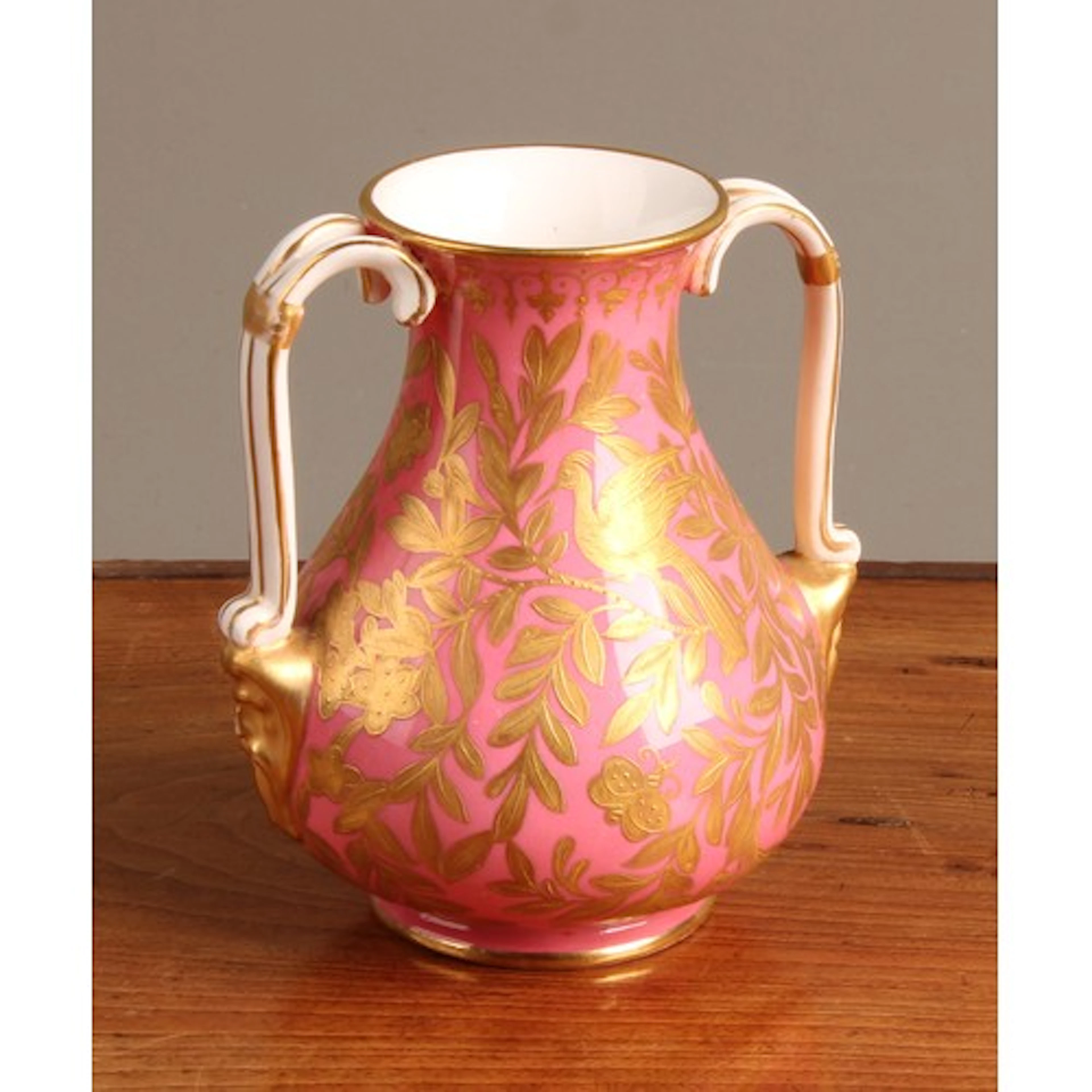 A 19th century Derby two handled baluster vase, decorated in...