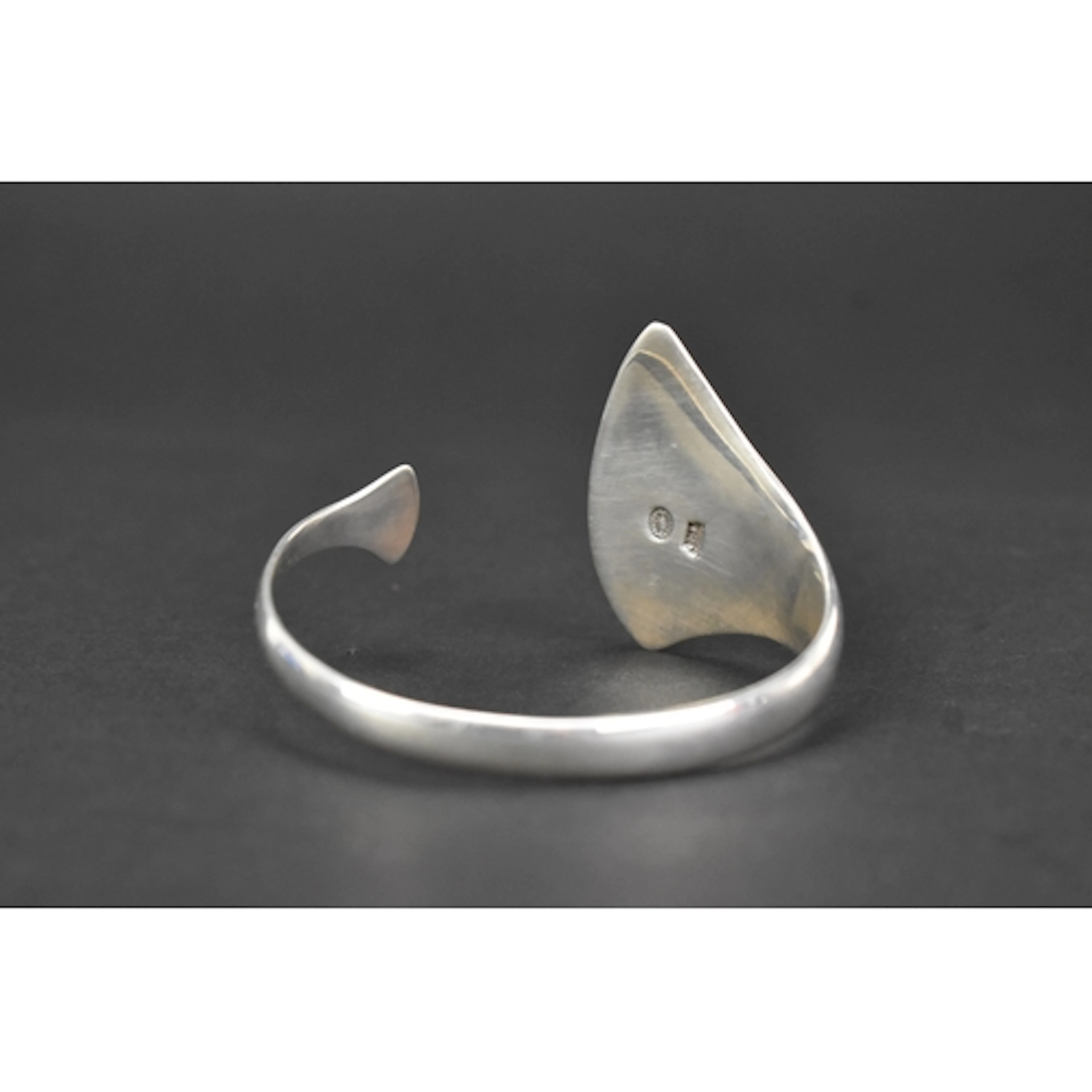A Georg Jensen silver 'Peak' bangle, designed by Bent Gabrie...