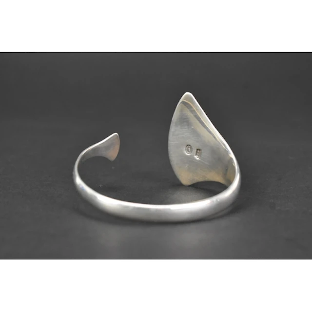 A Georg Jensen silver 'Peak' bangle, designed by Bent Gabrie...
