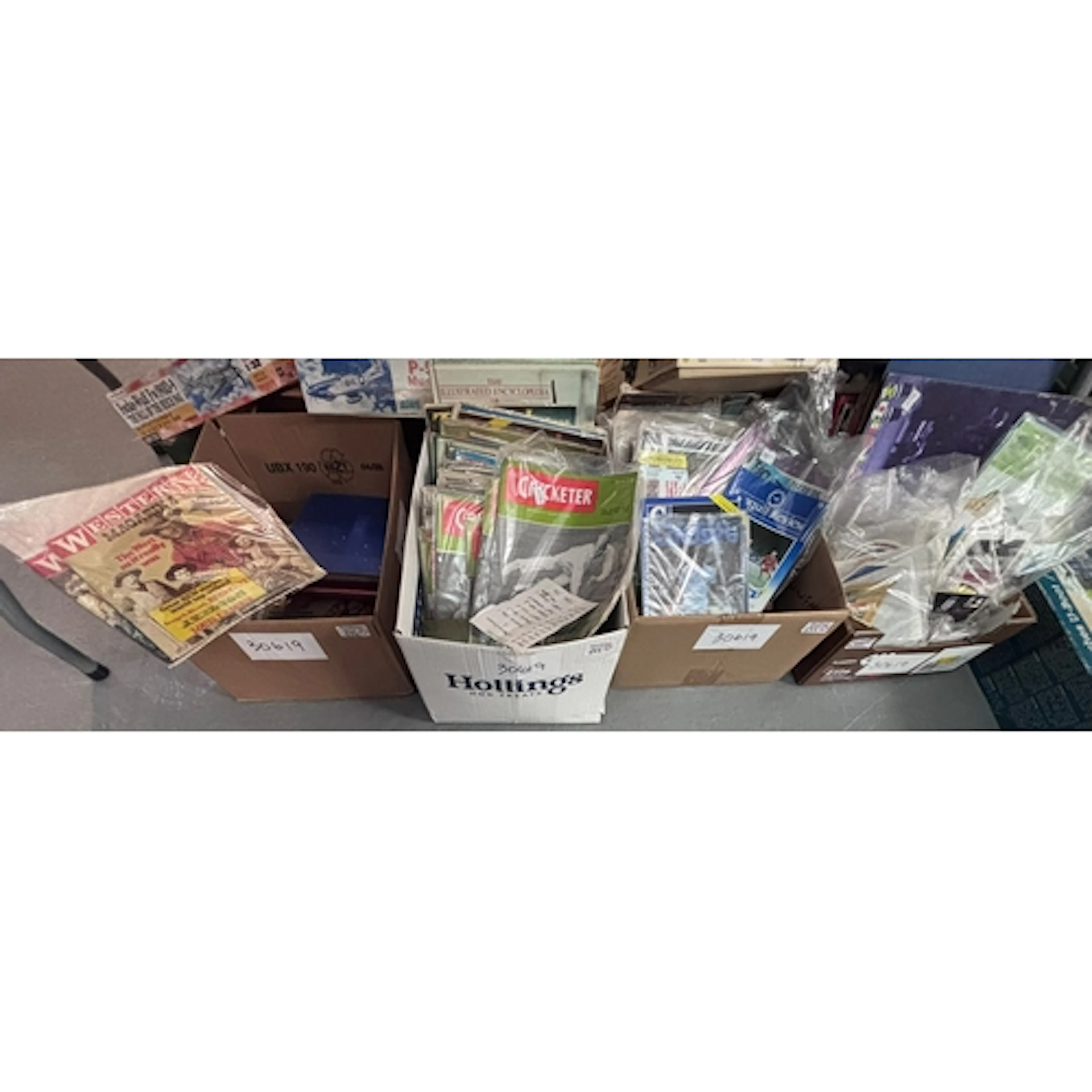 Four boxes of assorted ephemera to include: 'The Cricketer' ...