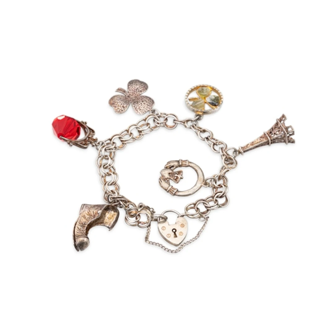 A STERLING SILVER CHARM BRACELET