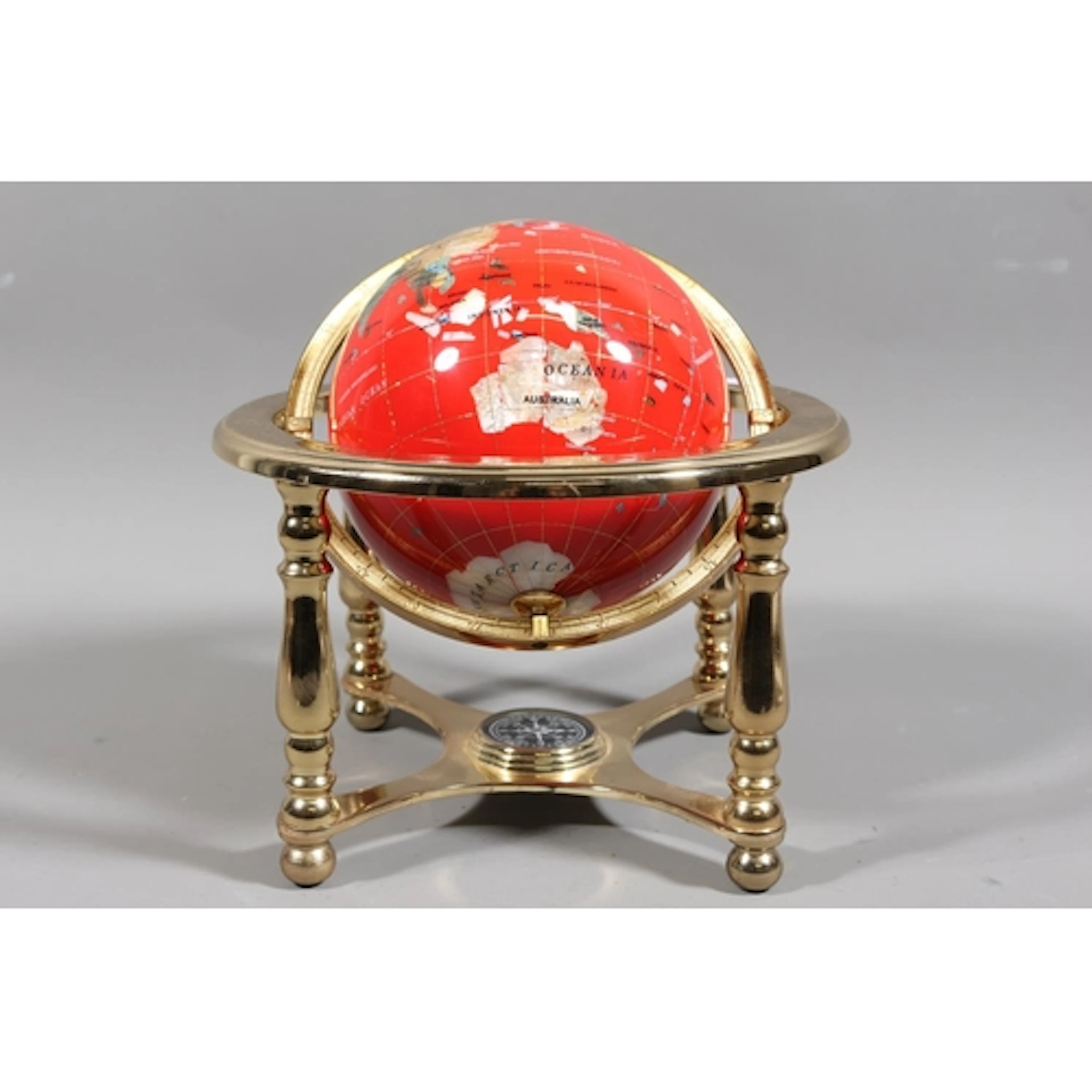 Red Lapis globe on stand.