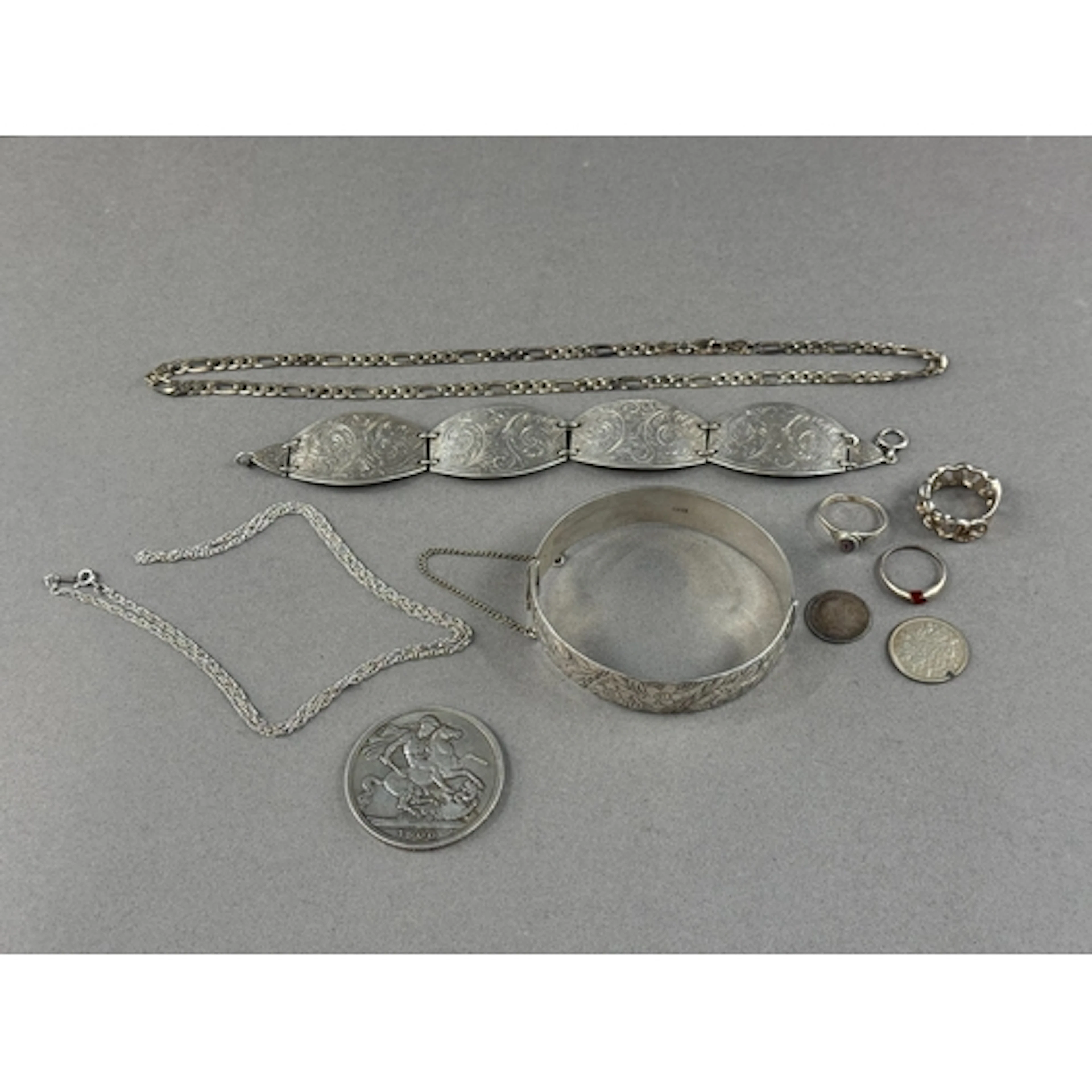 Jewellery: a silver four panel bracelet, Birmingham 1941, en...