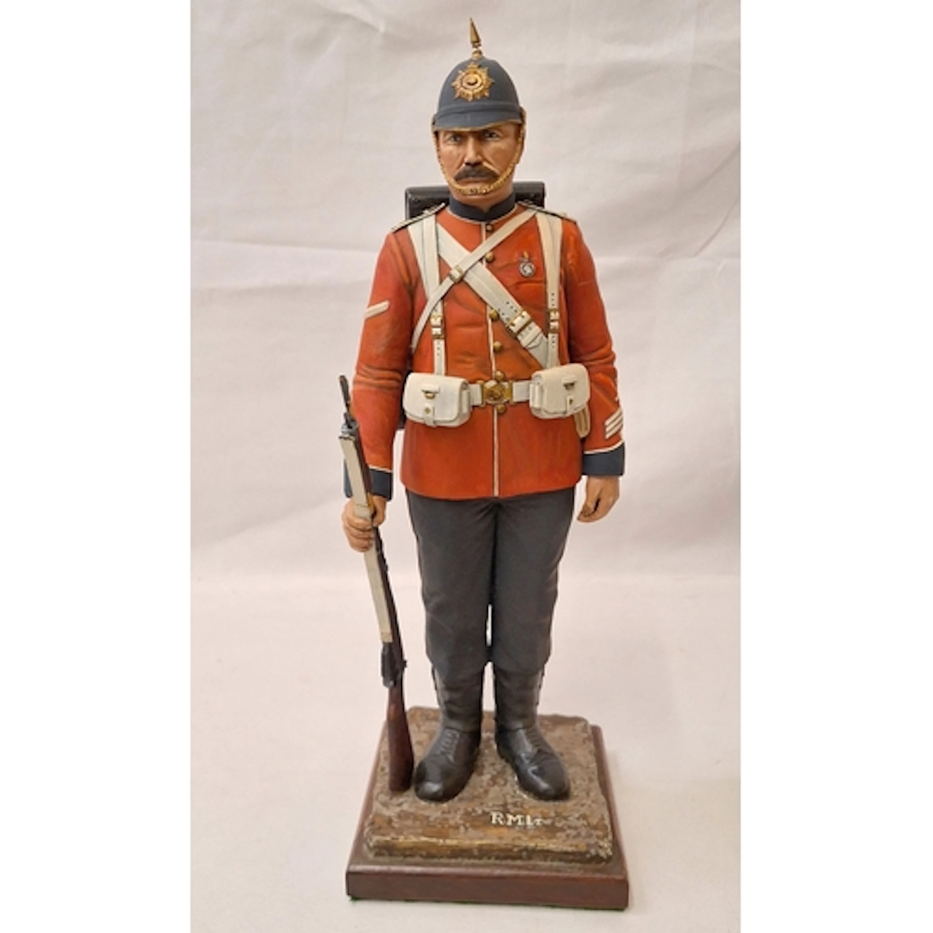 Tall Composition Red Coat Figurine marked R.M.LT to plinth a...