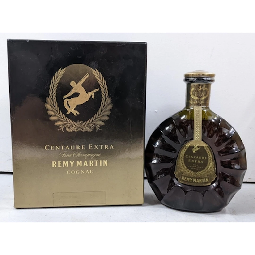 A bottle of Rémy Martin Centaure Extra Fine Champagne Cognac...