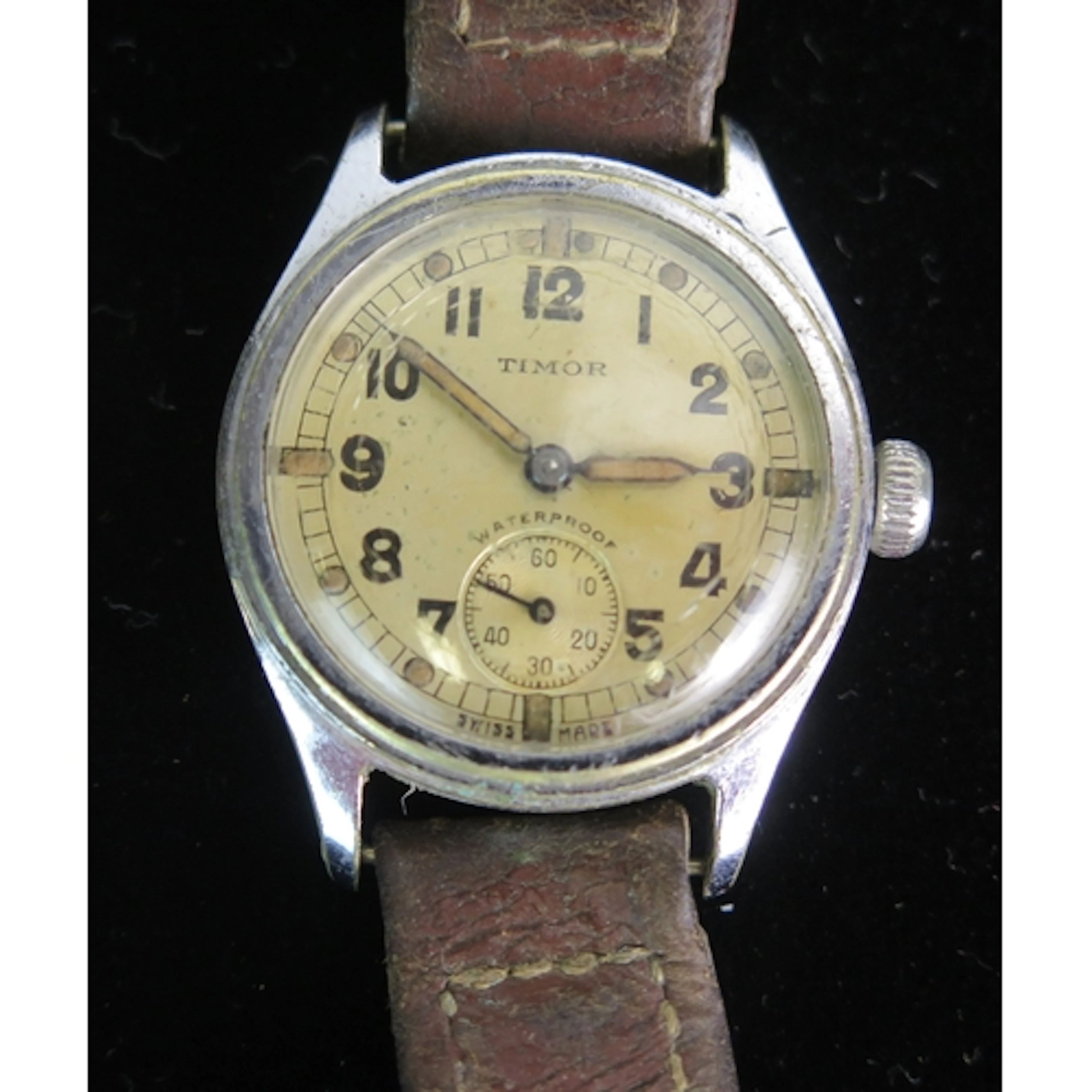 A Timor military waterproof wristwatch, c. 31mm case, the ba...