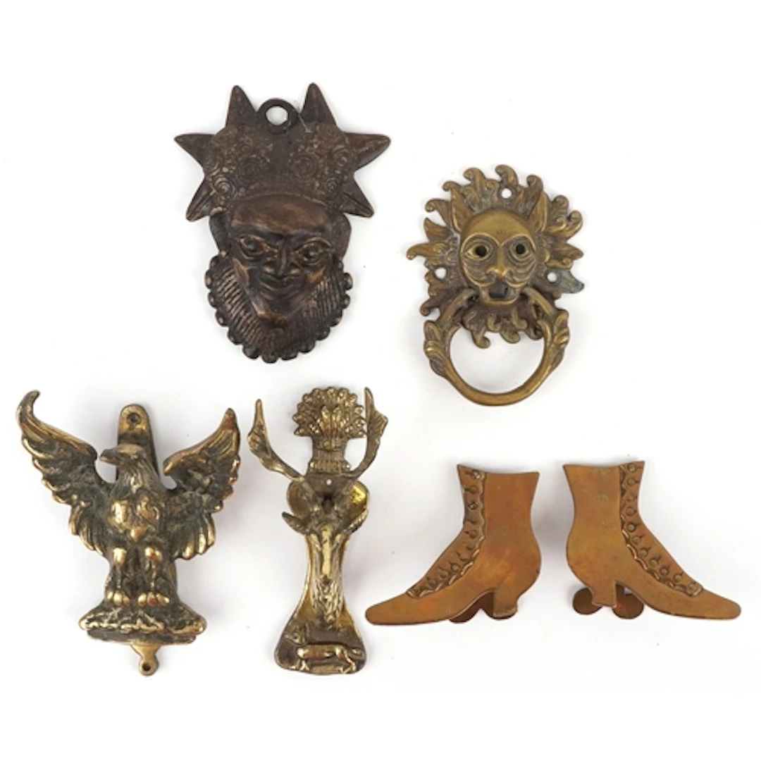 Antique and later brassware including door knockers in the f...