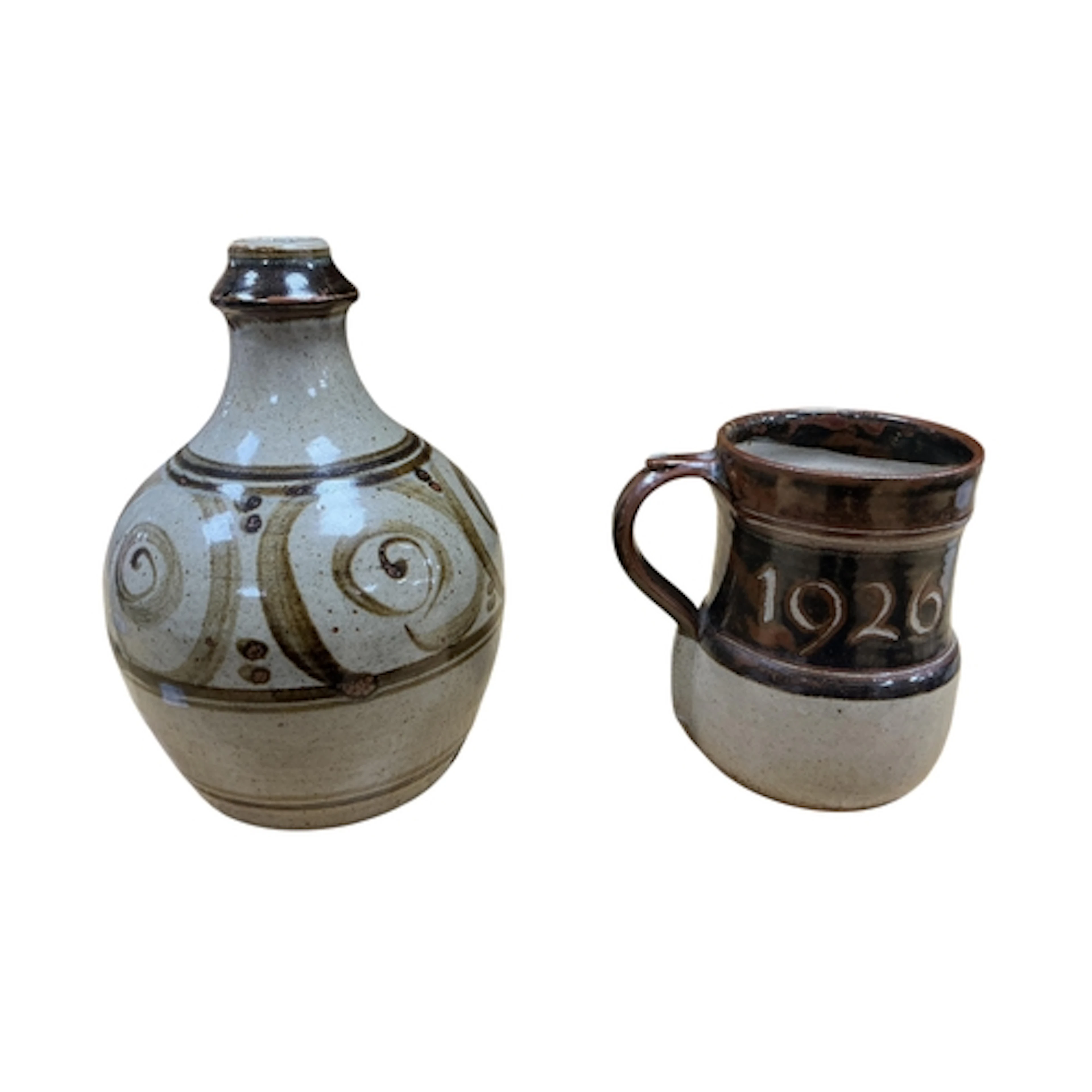 Two pieces of Winchcombe pottery comprising a jug dated 1976...