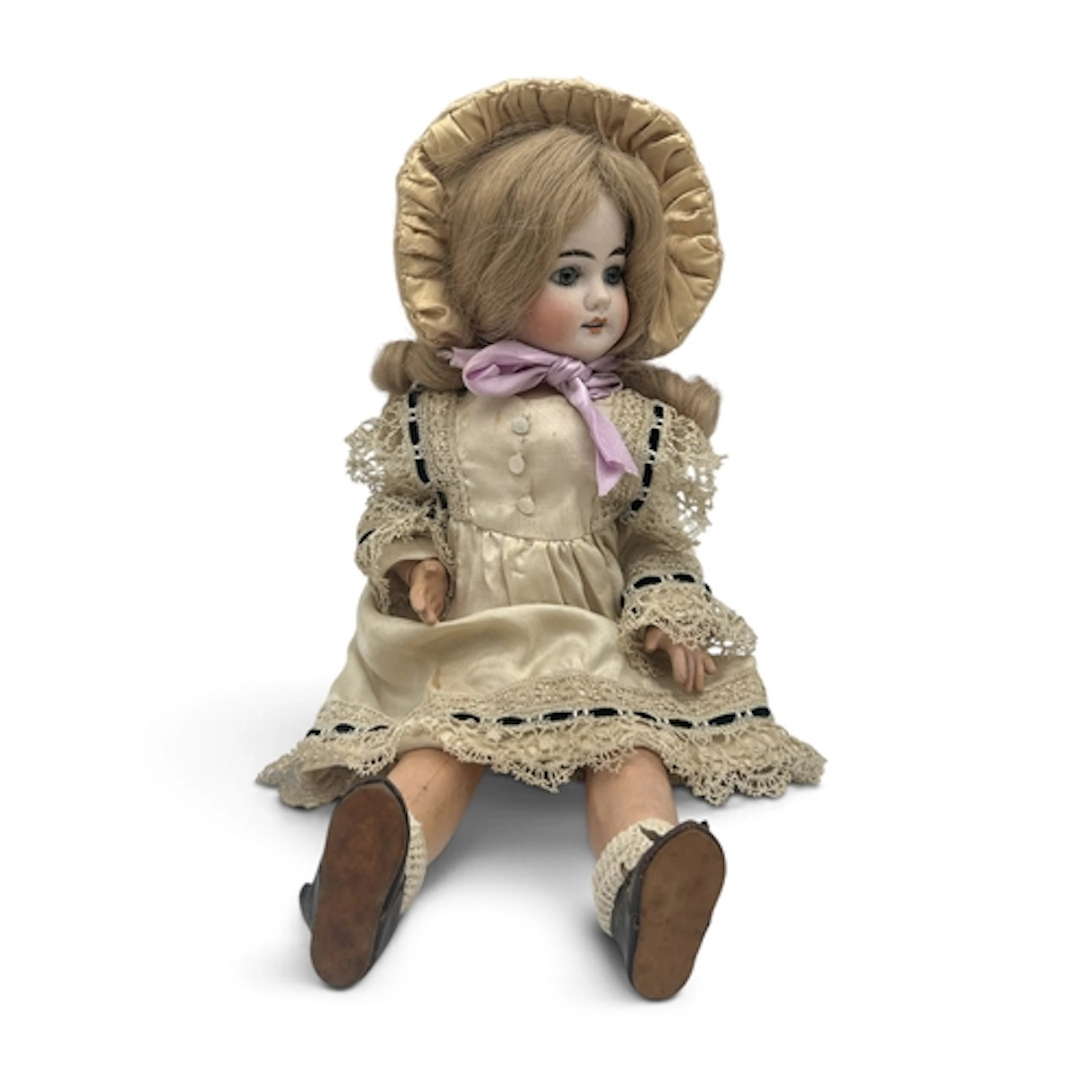 A GERMAN BISQUE-HEADED DOLL With blue eyes and blonde hair. ...