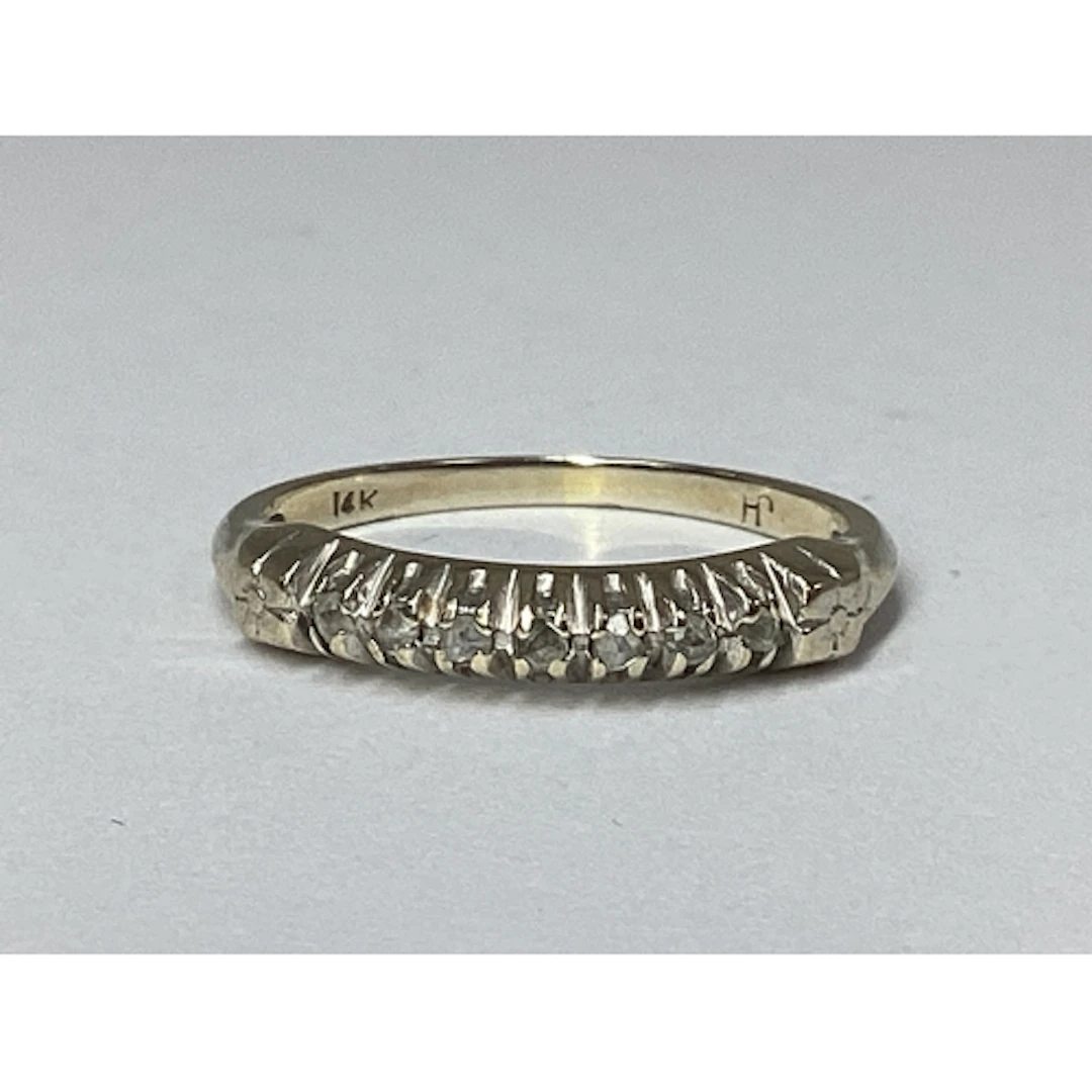 A Dainty Half Eternity Style Ring, claw set highlights, stam...