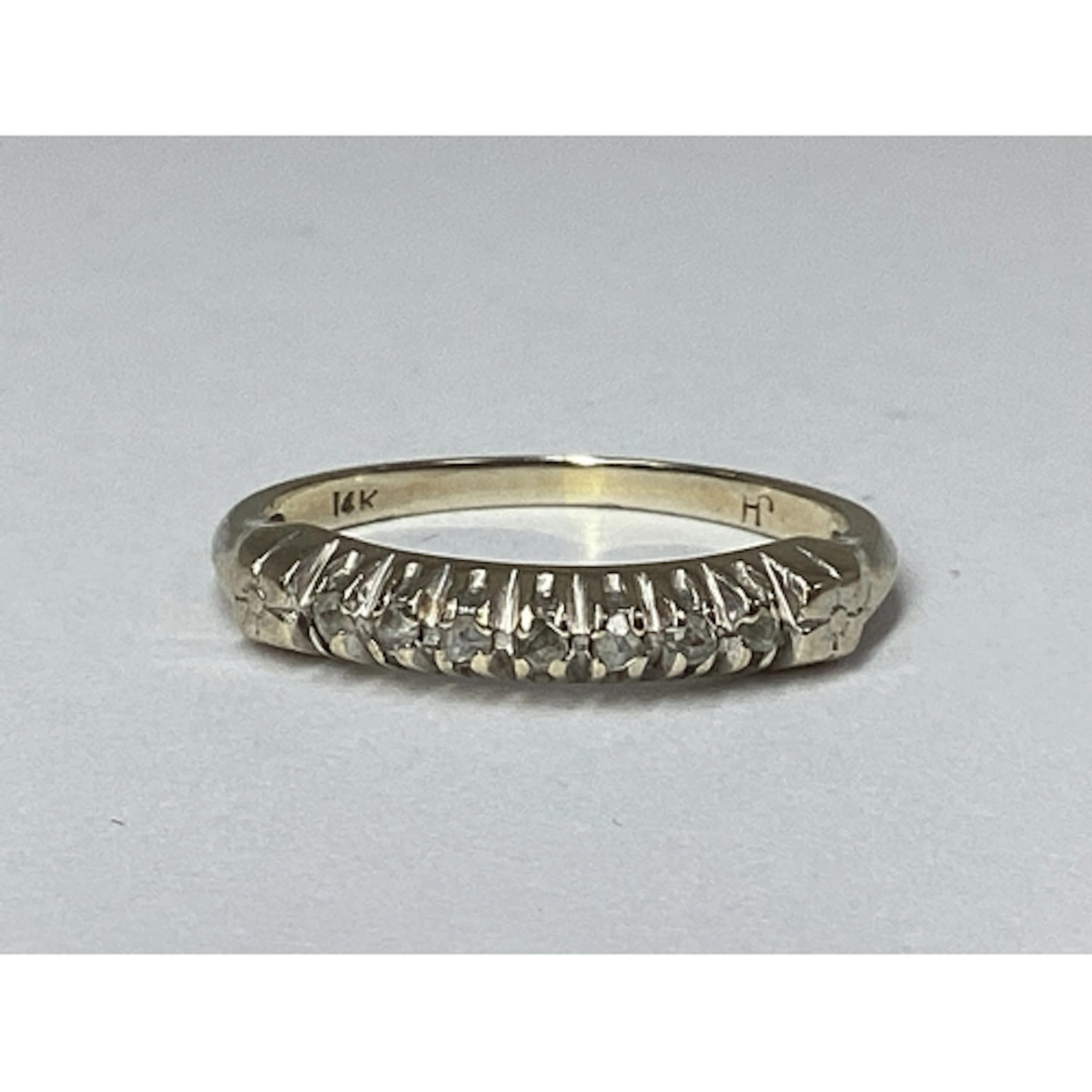 A Dainty Half Eternity Style Ring, claw set highlights, stam...